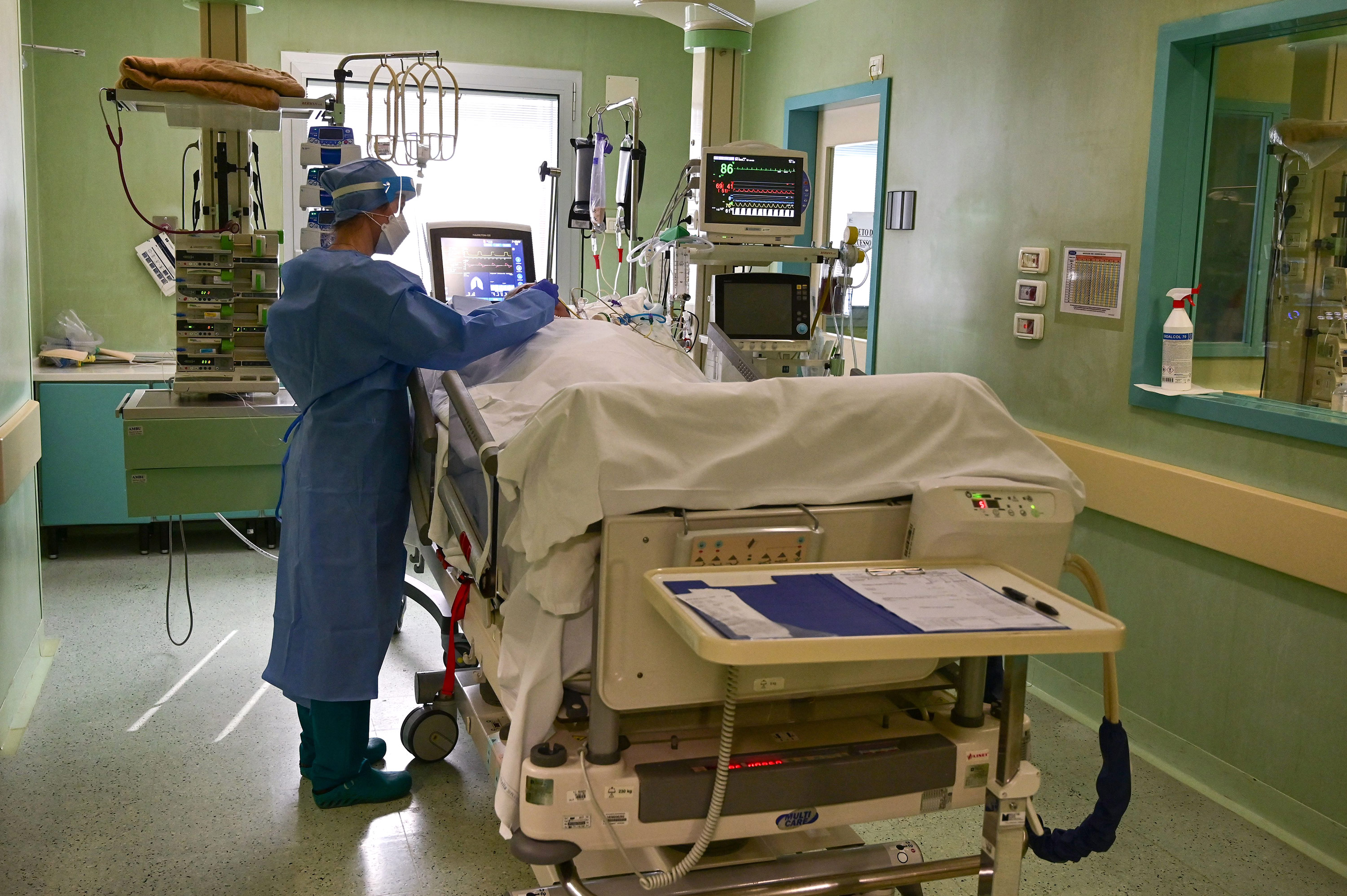 A member of the medical staff tends to a patient in the Covid-19 unit of the Bolognini hospital in Bergamo, Italy, on March 12. 