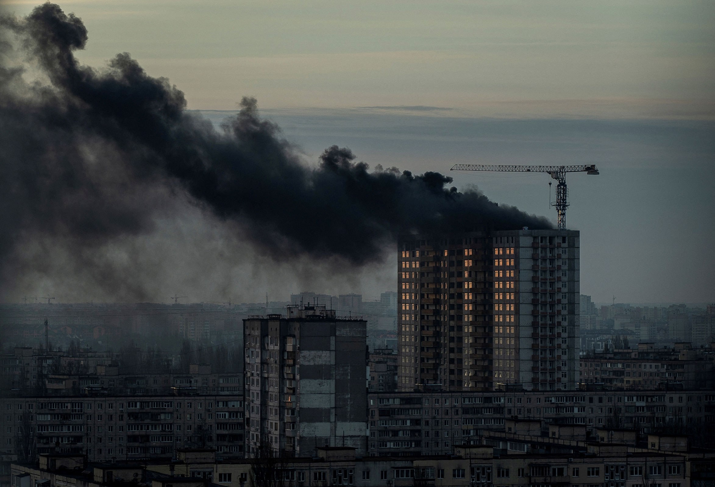 Smoke rises over a residential building after a Russian missile and drone strike in Kyiv, Ukraine, on December 29.