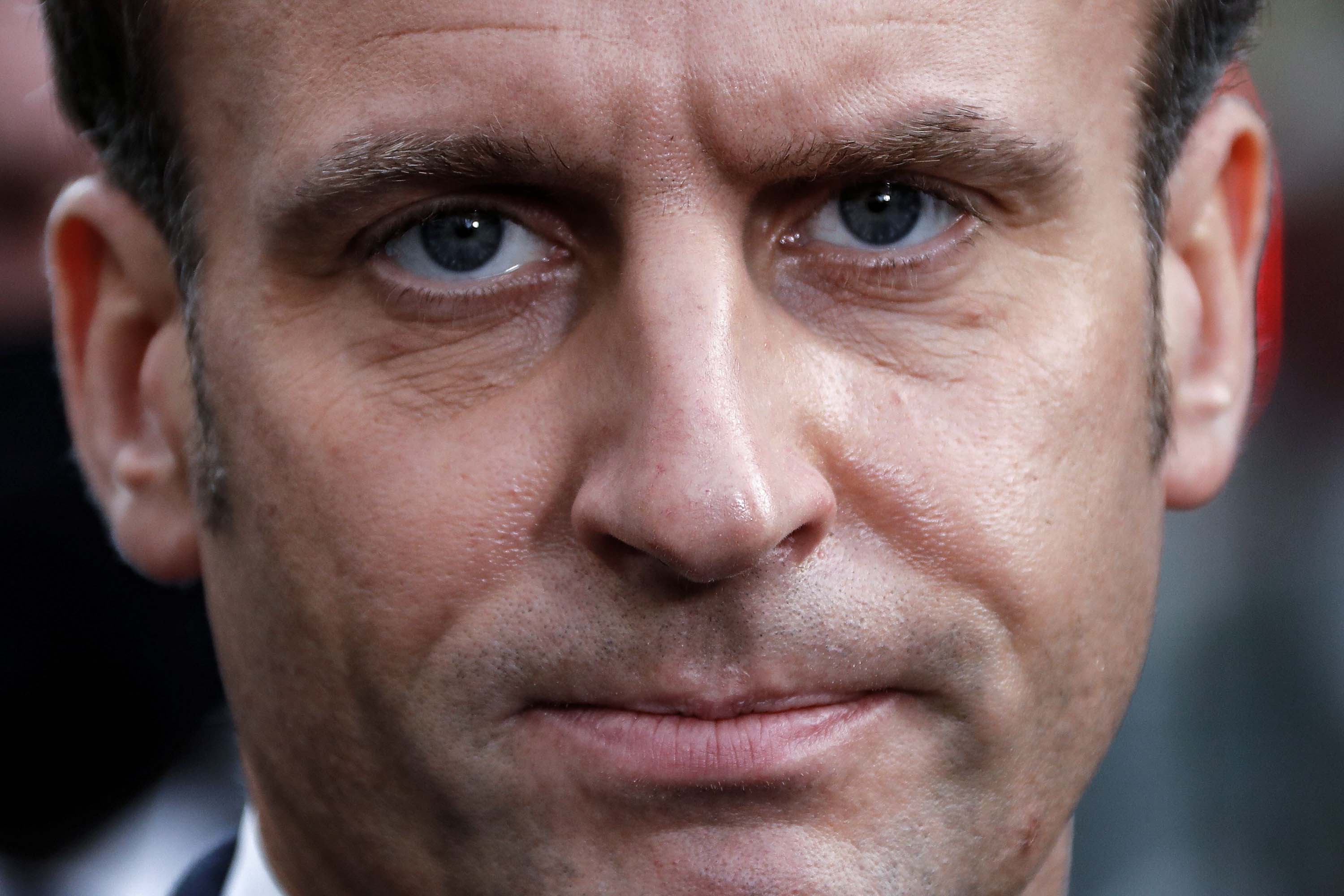 French President Emmanuel Macron speaks to the press outside the the Notre-Dame Basilica in Nice on Thursday.