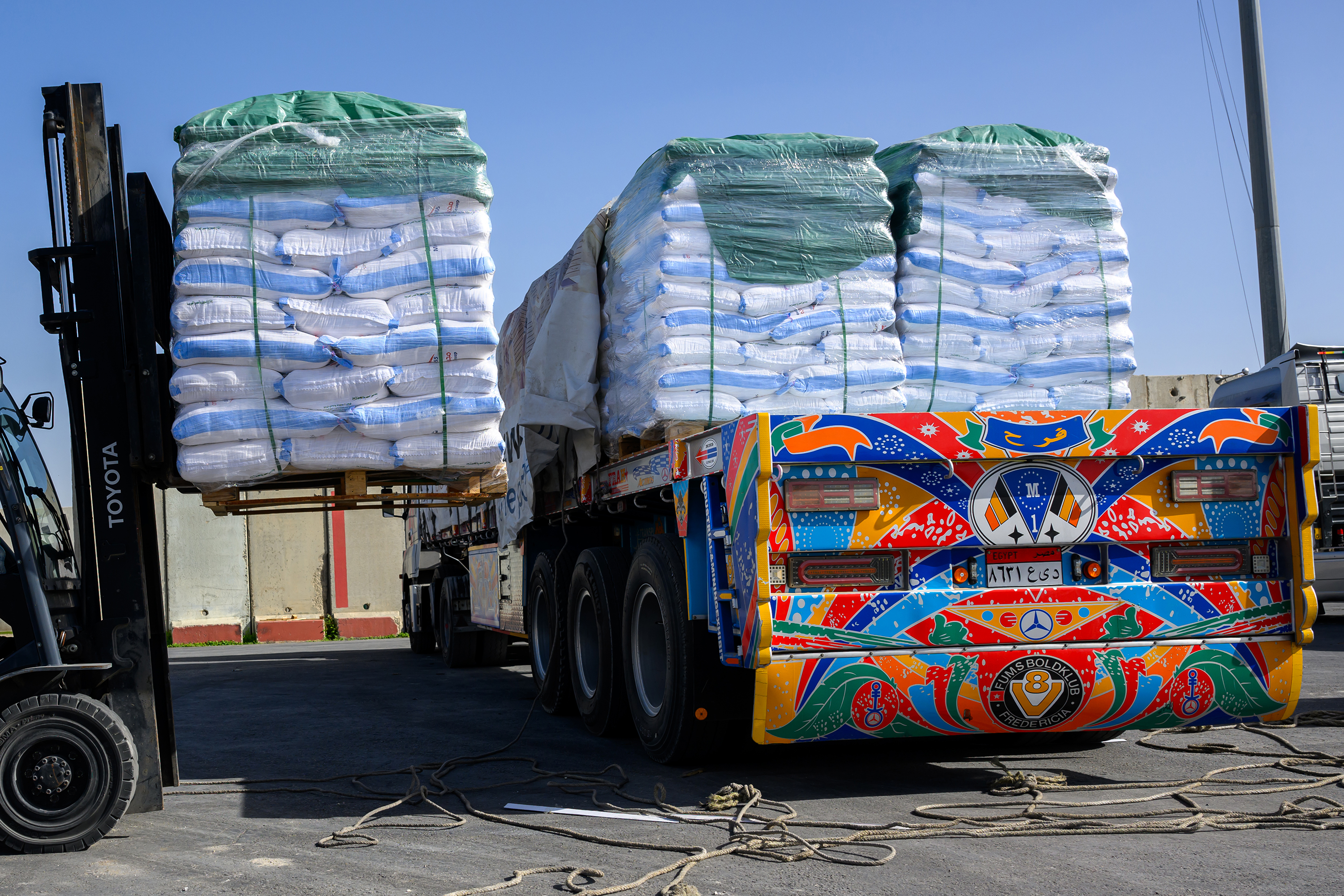 Pallets of humanitarian aid are unloaded and inspected before entering Gaza at the Kerem Shalom Crossing on December 22, Kerem Shalom, Israel.
