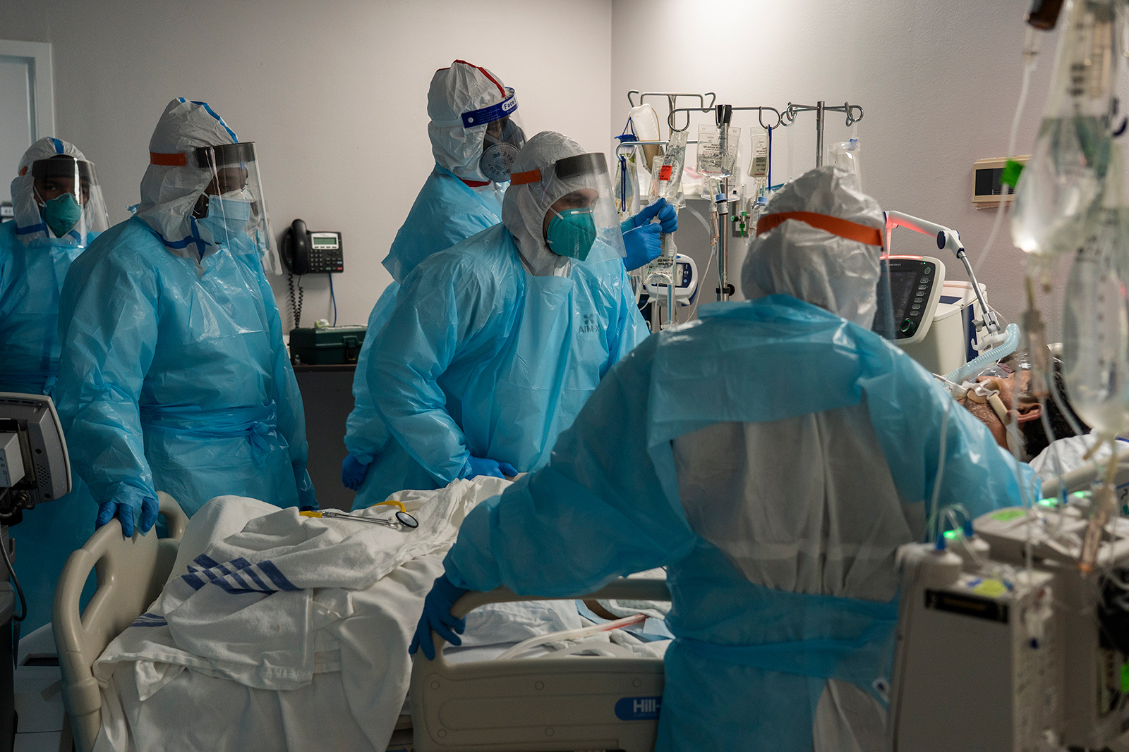 Medical staff members treat a patient in the Covid-19 intensive care unit at the United Memorial Medical Center on December 22, in Houston.