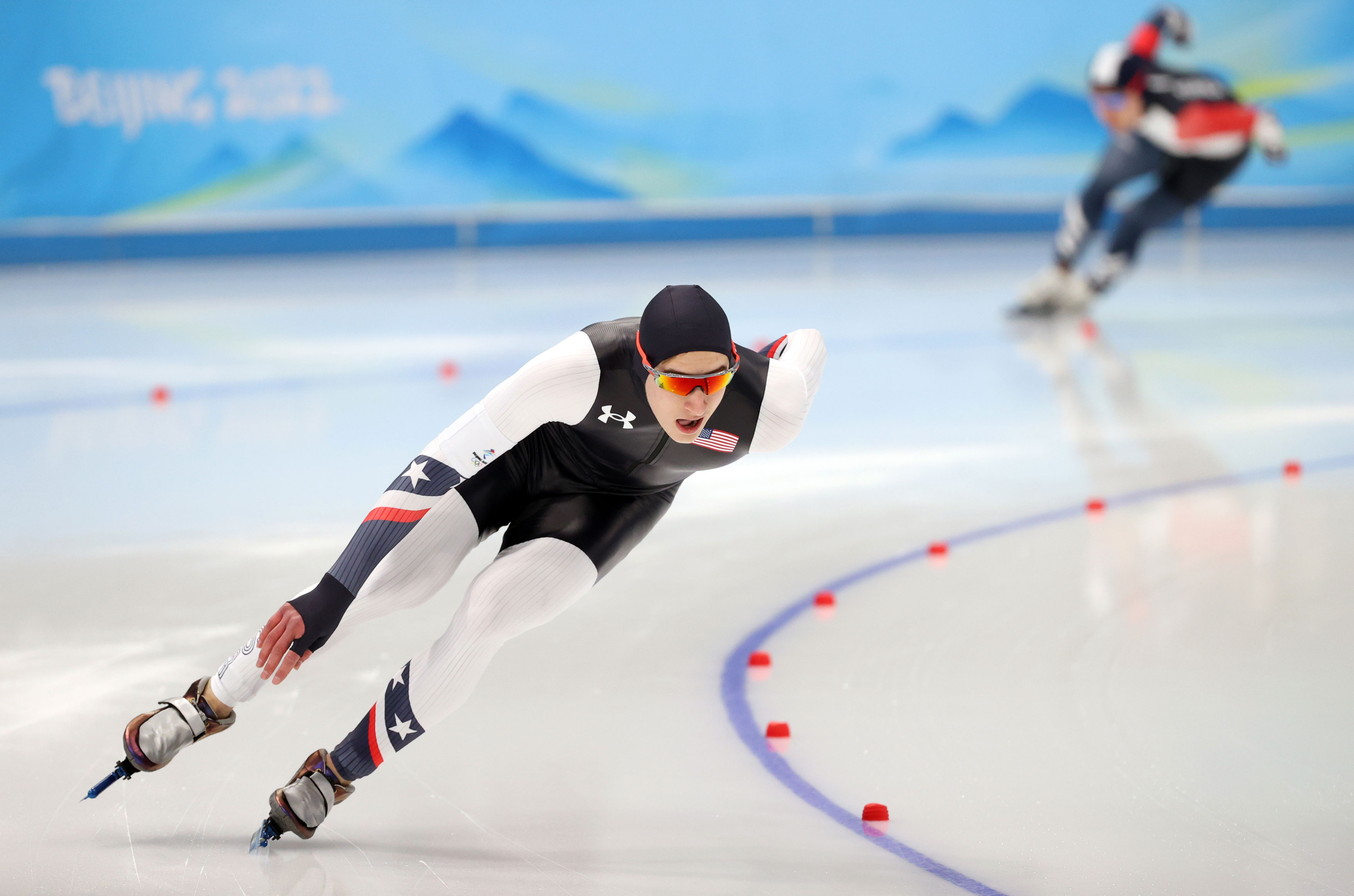 Jordan Stolz (L) of Team USA and Kim Min-seok of South Korea compete in the men's 1,000m speed skating race on Friday.