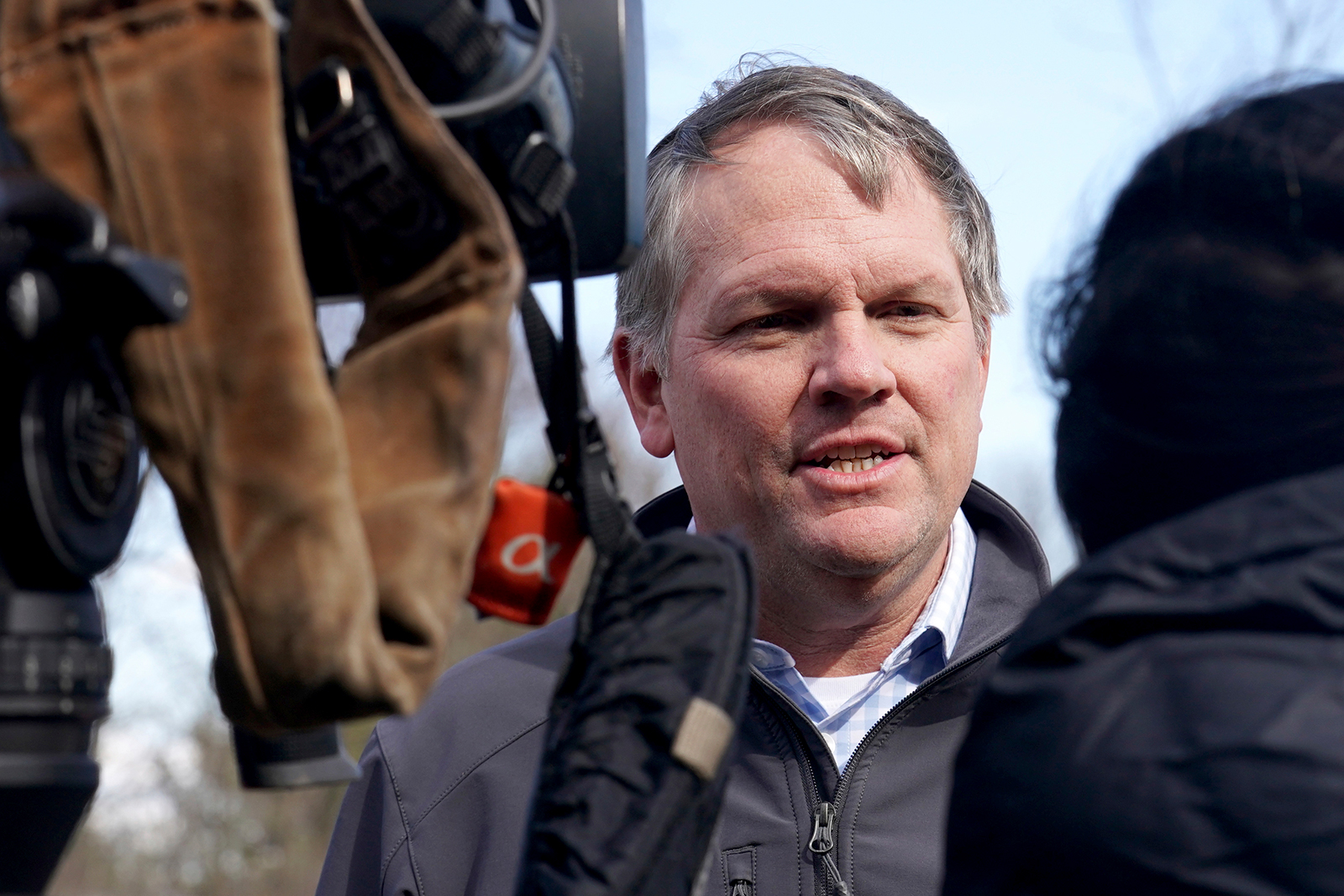 Alan Shaw speaks to reporters near the site where a freight train derailed,  in East Palestine, Ohio on Tuesday, February 21.