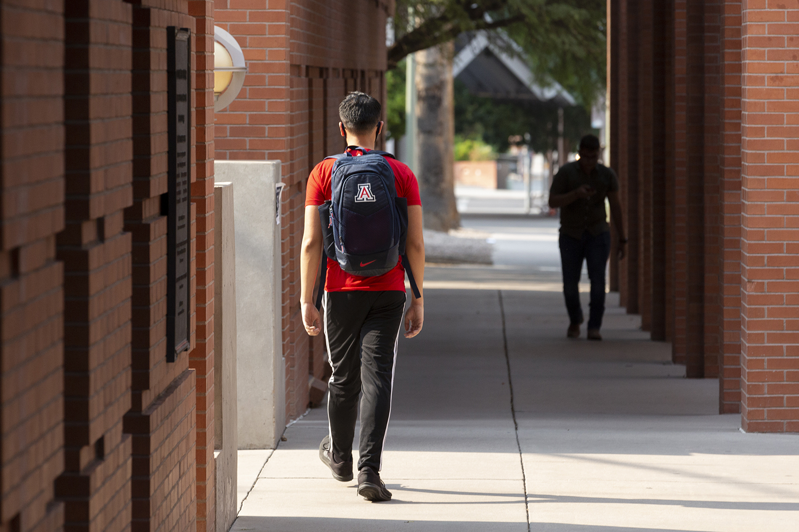 Students walk through the campus at the University of Arizona in Tucson, Arizona, on August 24.