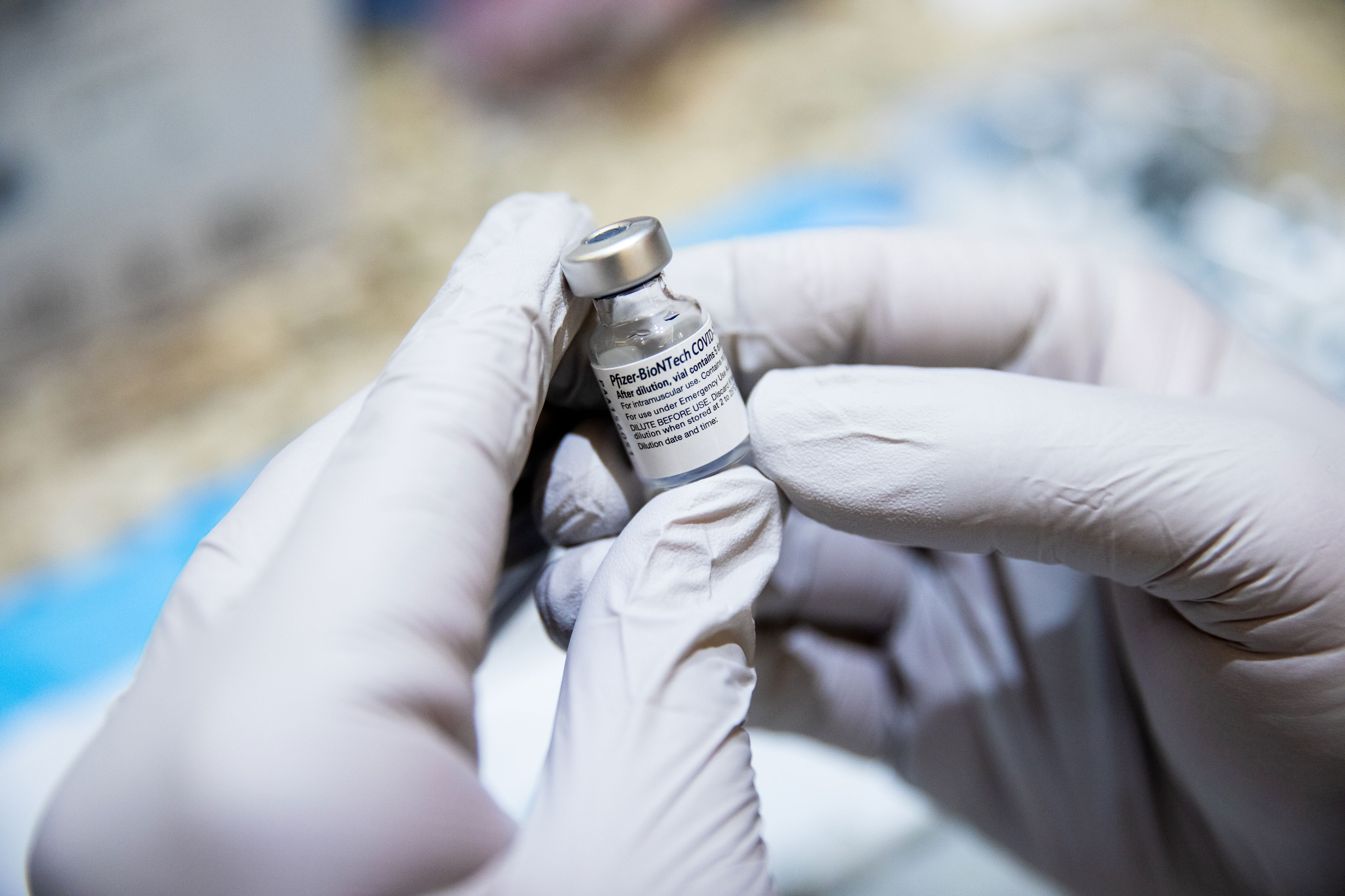 A health care worker holds a vial of the Pfizer/BioNTech Covid-19 vaccine in Henderson, Nevada, on February 11.