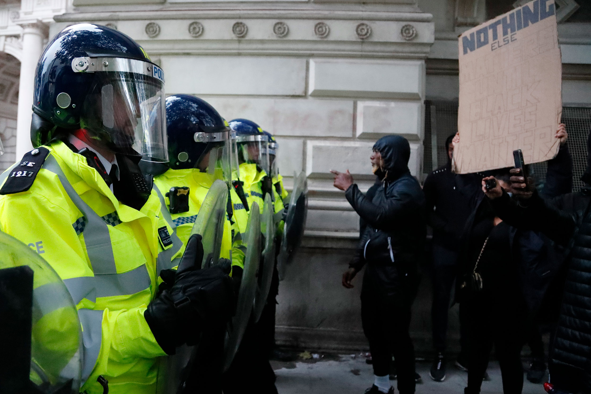 Police confront protesters during the Black Lives Matter rally in London on Sunday, June 7.