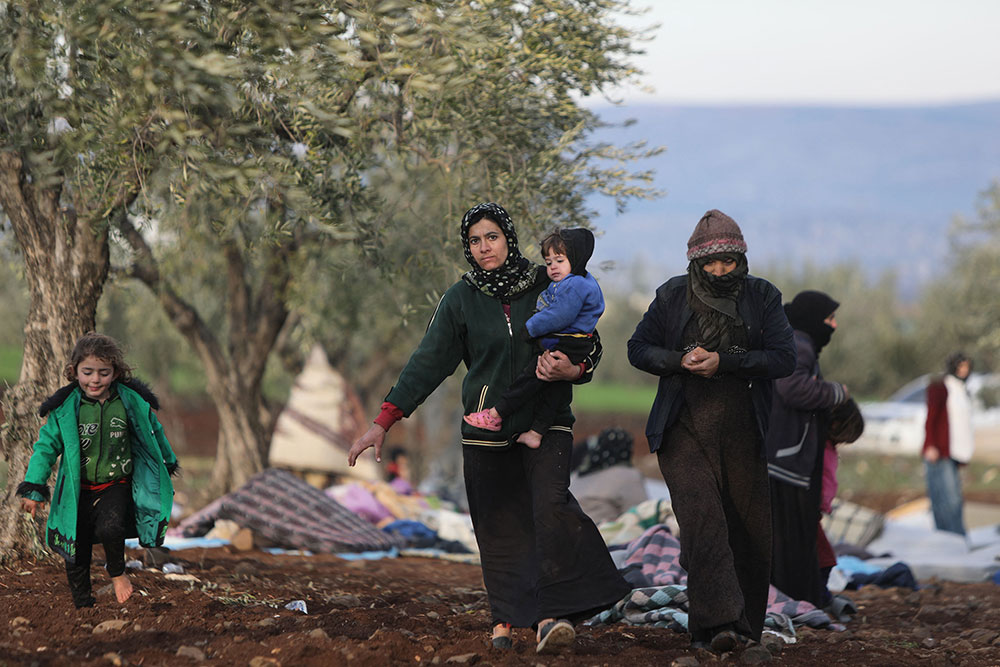 Displaced Syrians take shelter on the outskirts of the rebel-held town of Jindayris on February 8.