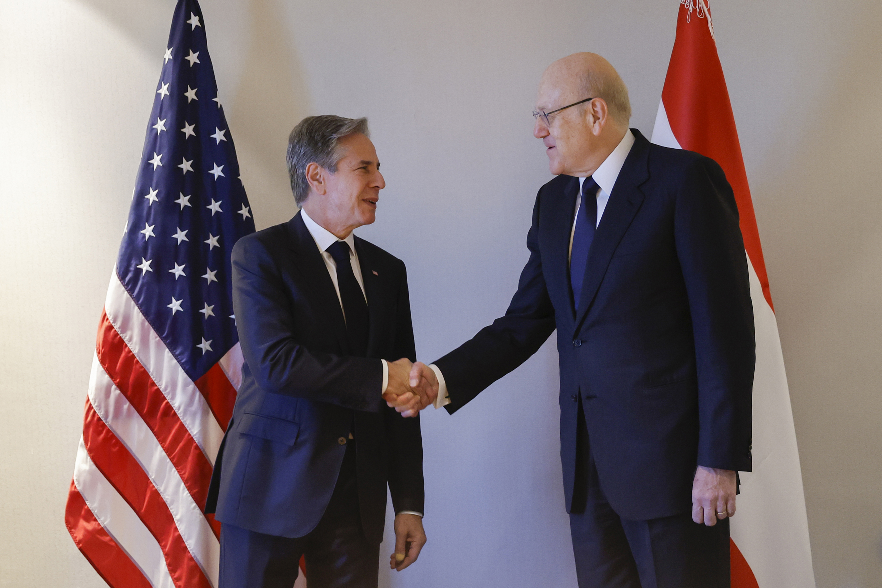 US Secretary of State Antony Blinken, left, meets with Lebanese Caretaker Prime Minister Najib Mikati at his hotel during a day of meetings, in Amman, Jordan, on Saturday, November 4.