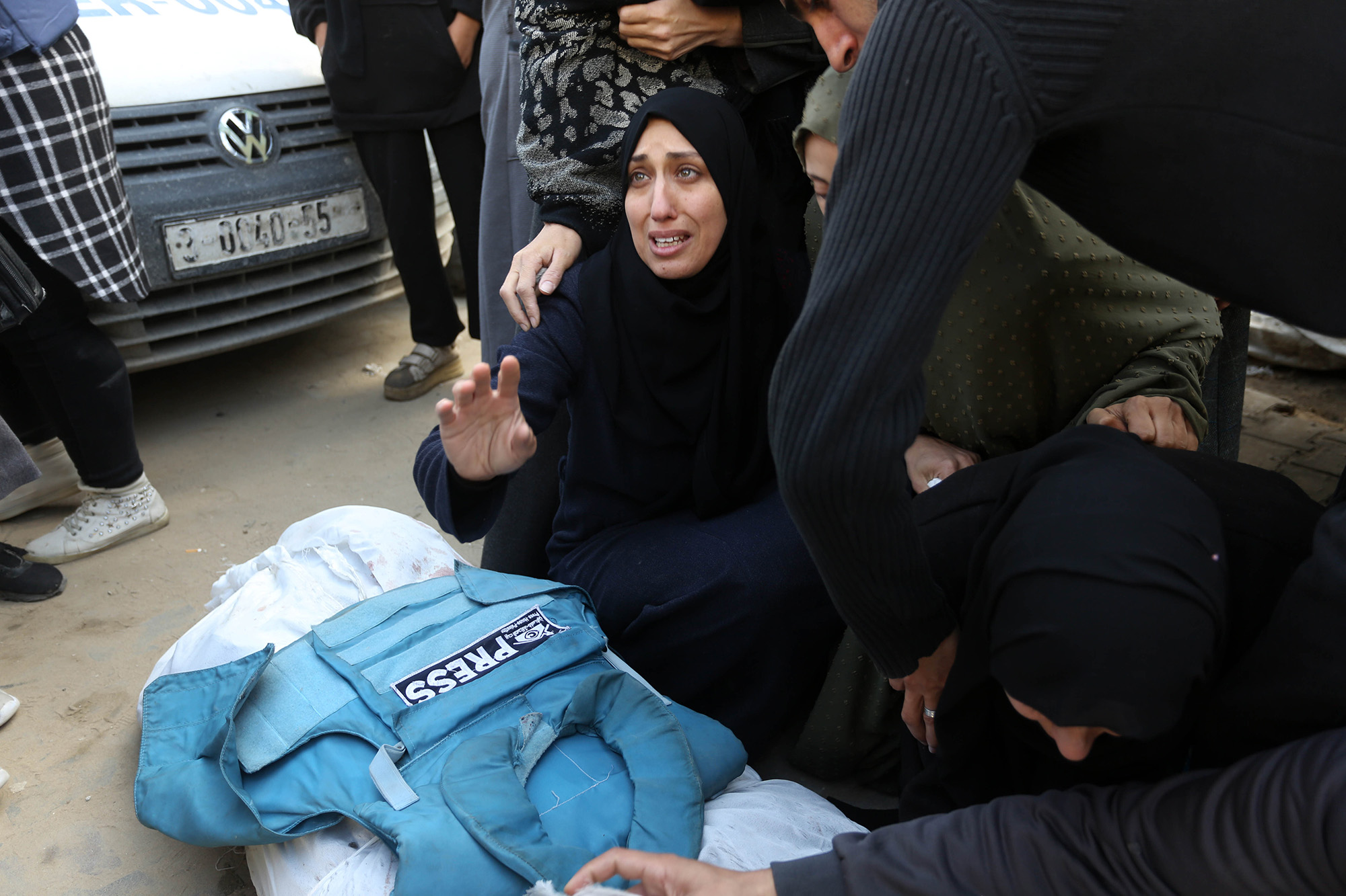 Relatives, loved ones and colleagues of Al-Aqsa TV anchor and journalist Mohammed Salamah attend his funeral ceremony held in front of Al-Aqsa Martyrs Hospital in Deir Al Balah, Gaza, on March 6.