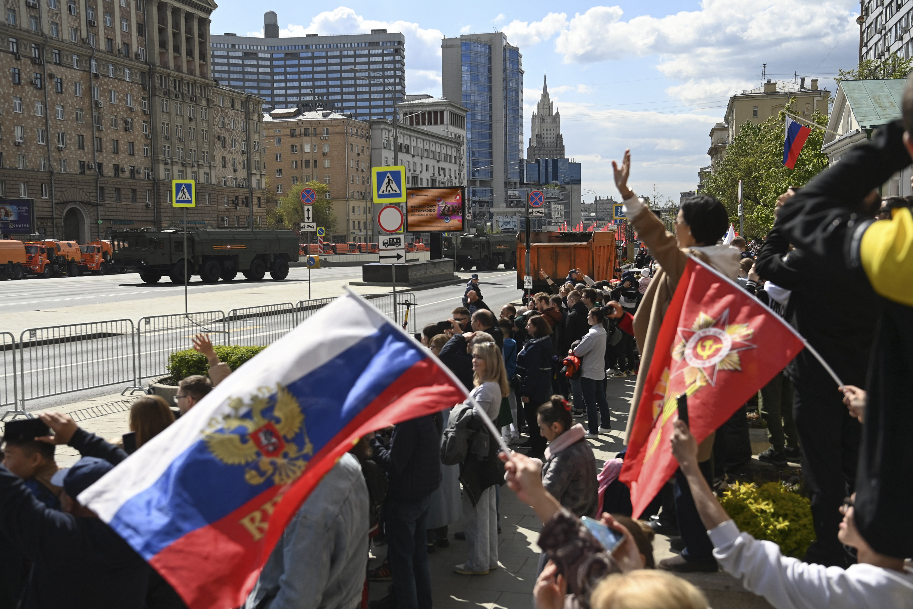 People watch the Victory Day military parade in Moscow on May 9. 