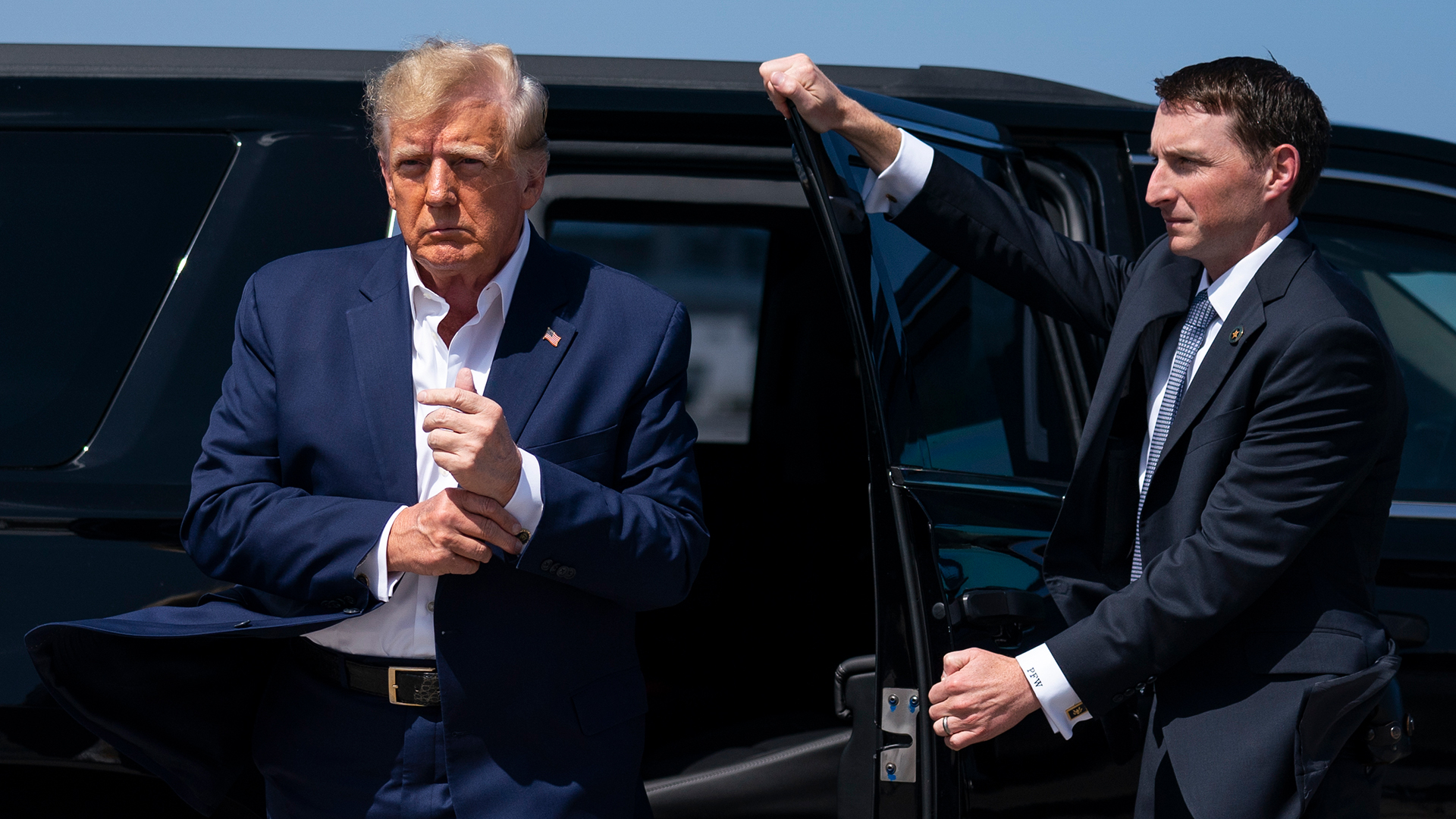 Former President Donald Trump arrives to board his airplane for a trip to a campaign rally in Waco, Texas, at West Palm Beach International Airport, March 25. 