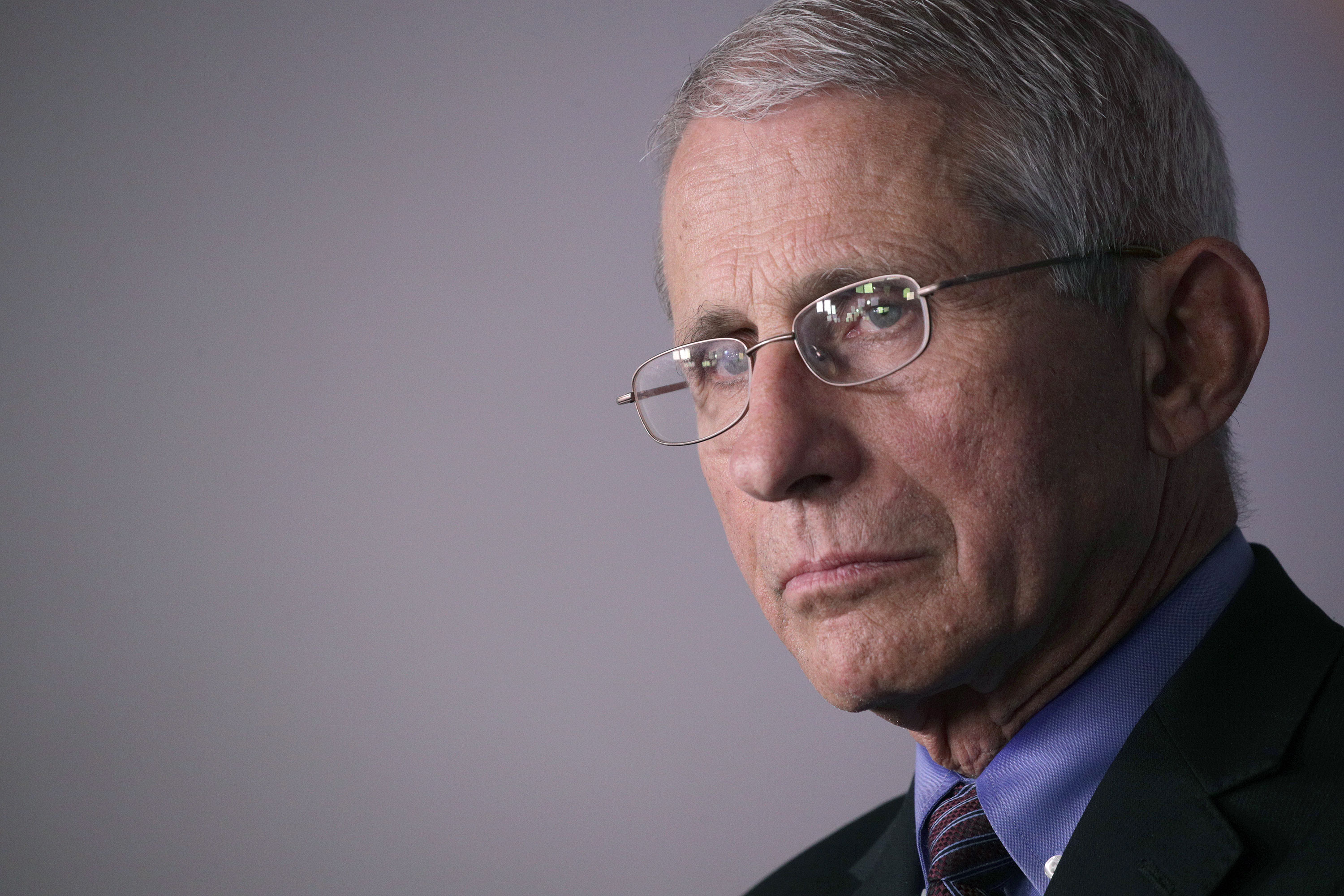 Dr. Anthony Fauci attends a coronavirus news briefing at the White House on April 9 in Washington.