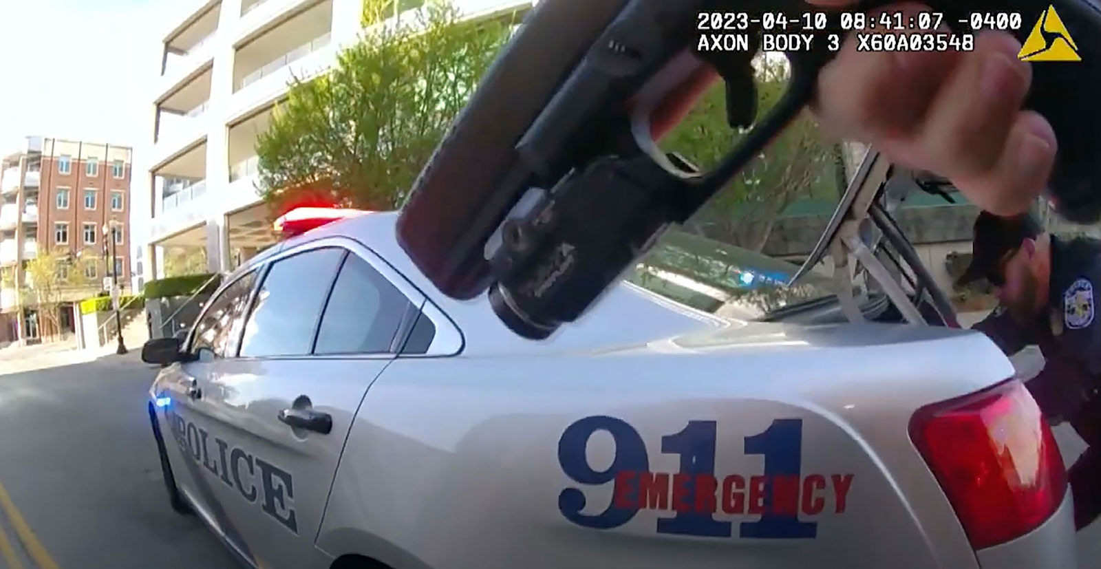 Officer N. Wilt's bodycam shows Officer C. Galloway preparing to approach the bank in downtown Louisville where a shooting took place. 