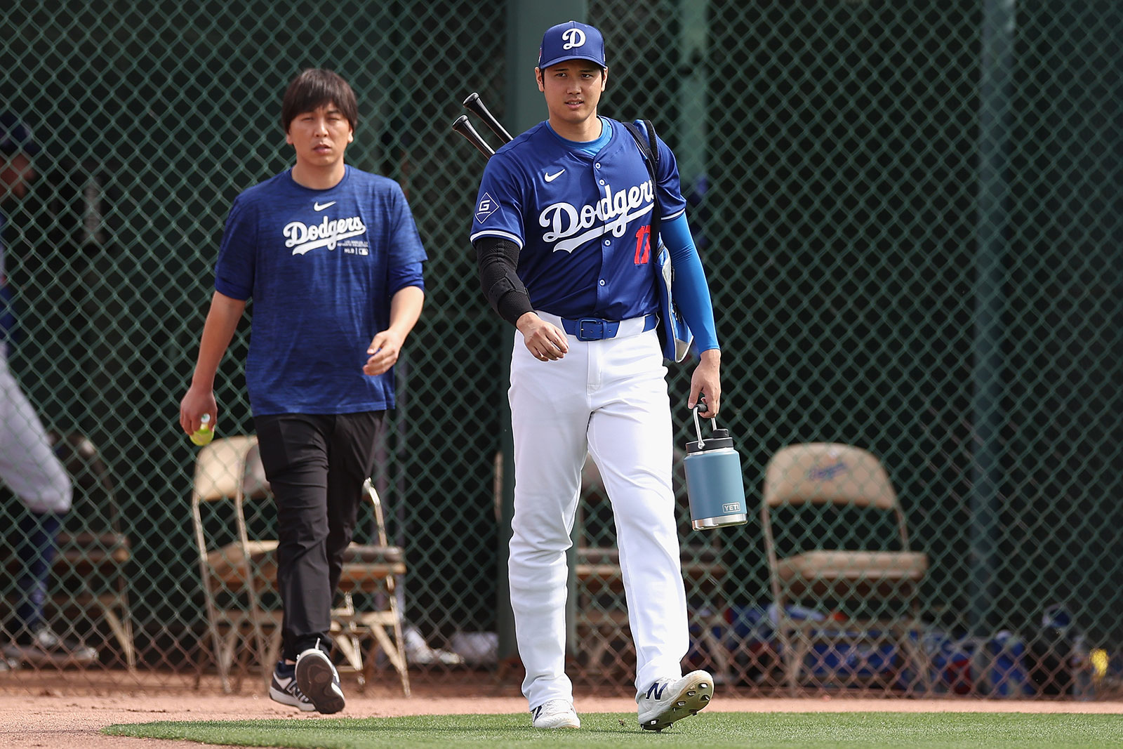 Shohei Ohtani, right, of the Los Angeles Dodgers and interpreter Ippei Mizuhara arrive to a game February 27 in Glendale, Arizona. 