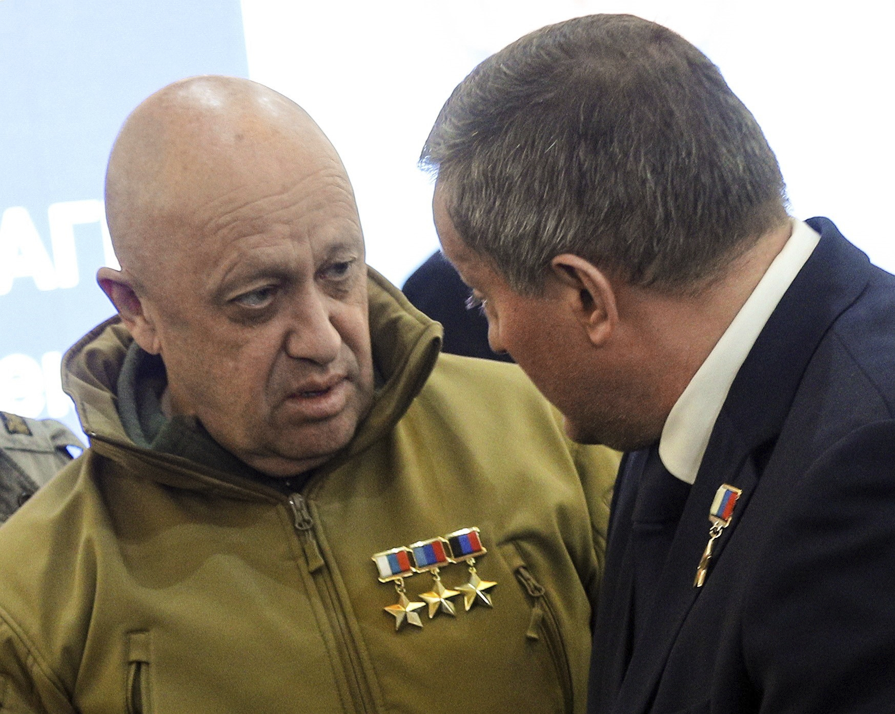 Wagner Group leader Yevgeny Prigozhin, left, and Governor of the Volgograd Region Andrey Bocharov attend a farewell ceremony for Wagner PMC soldier Alexei Nagin in Volgograd, Russia, on September 24.