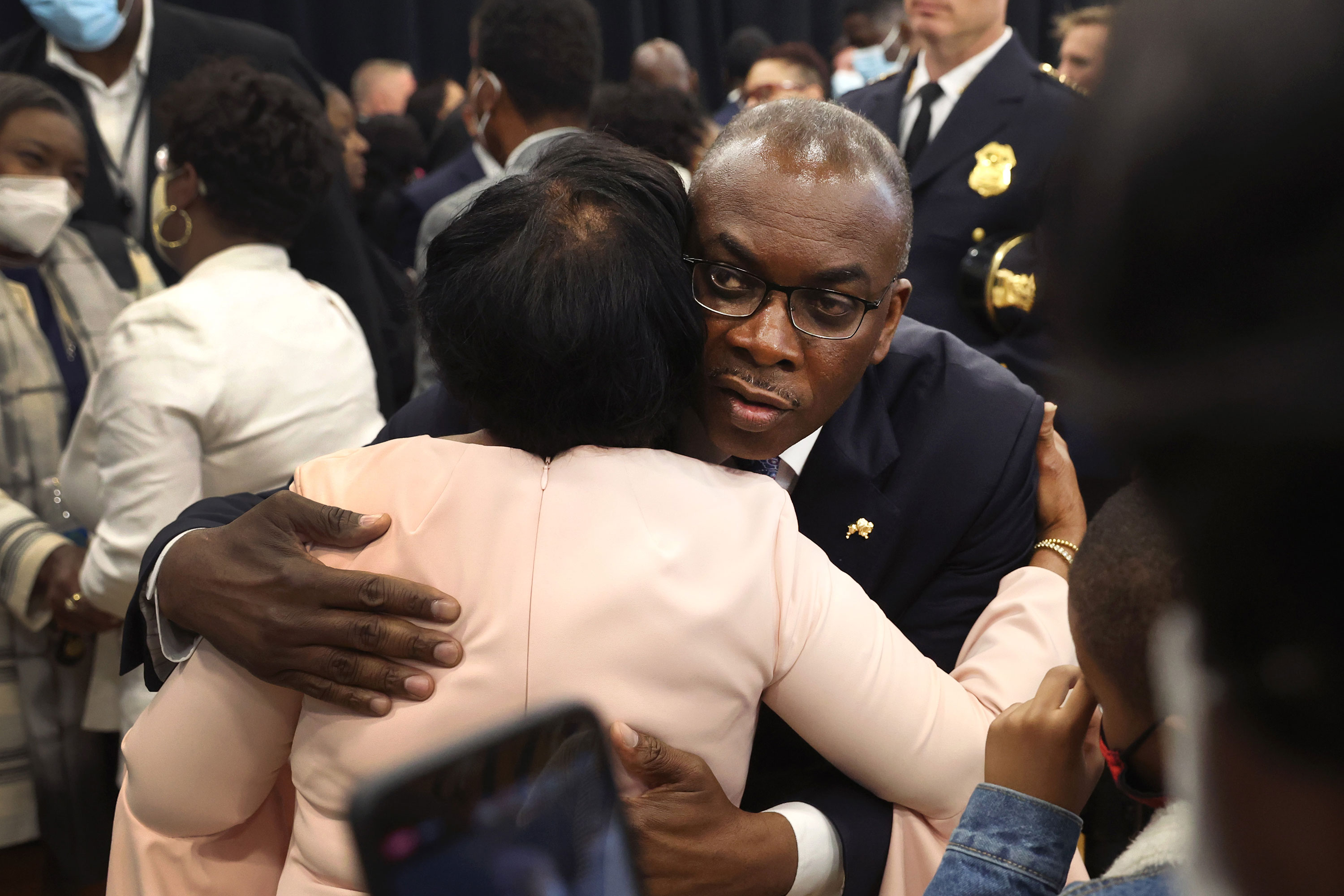 Mayor Byron Brown greets family members of victims of the Tops Friendly Market shooting in Buffalo on Tuesday.