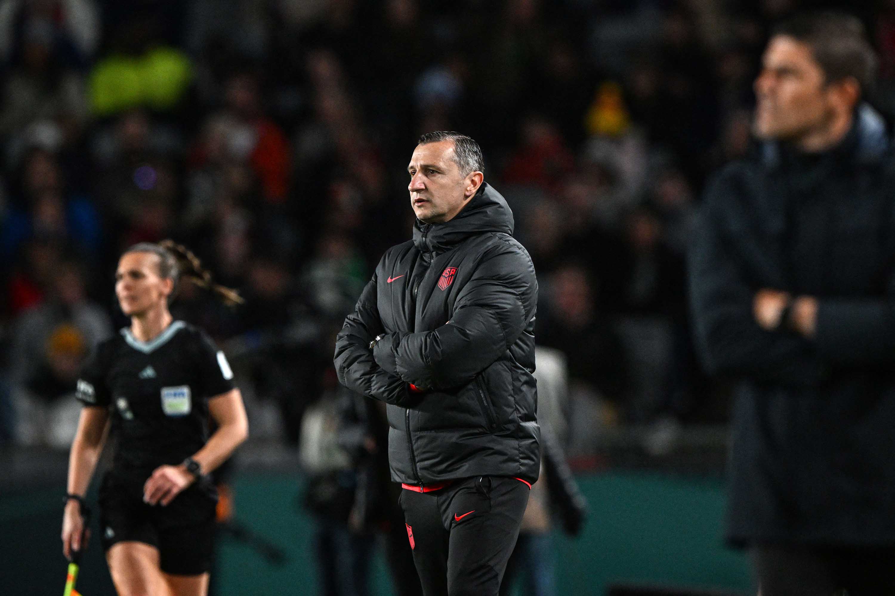 USA's coach Vlatko Andonovski, center, looks on next to Portugal's coach Francisco Neto, right, during the match between Portugal and the United States at Eden Park in Auckland, New Zealand, on August 1. 