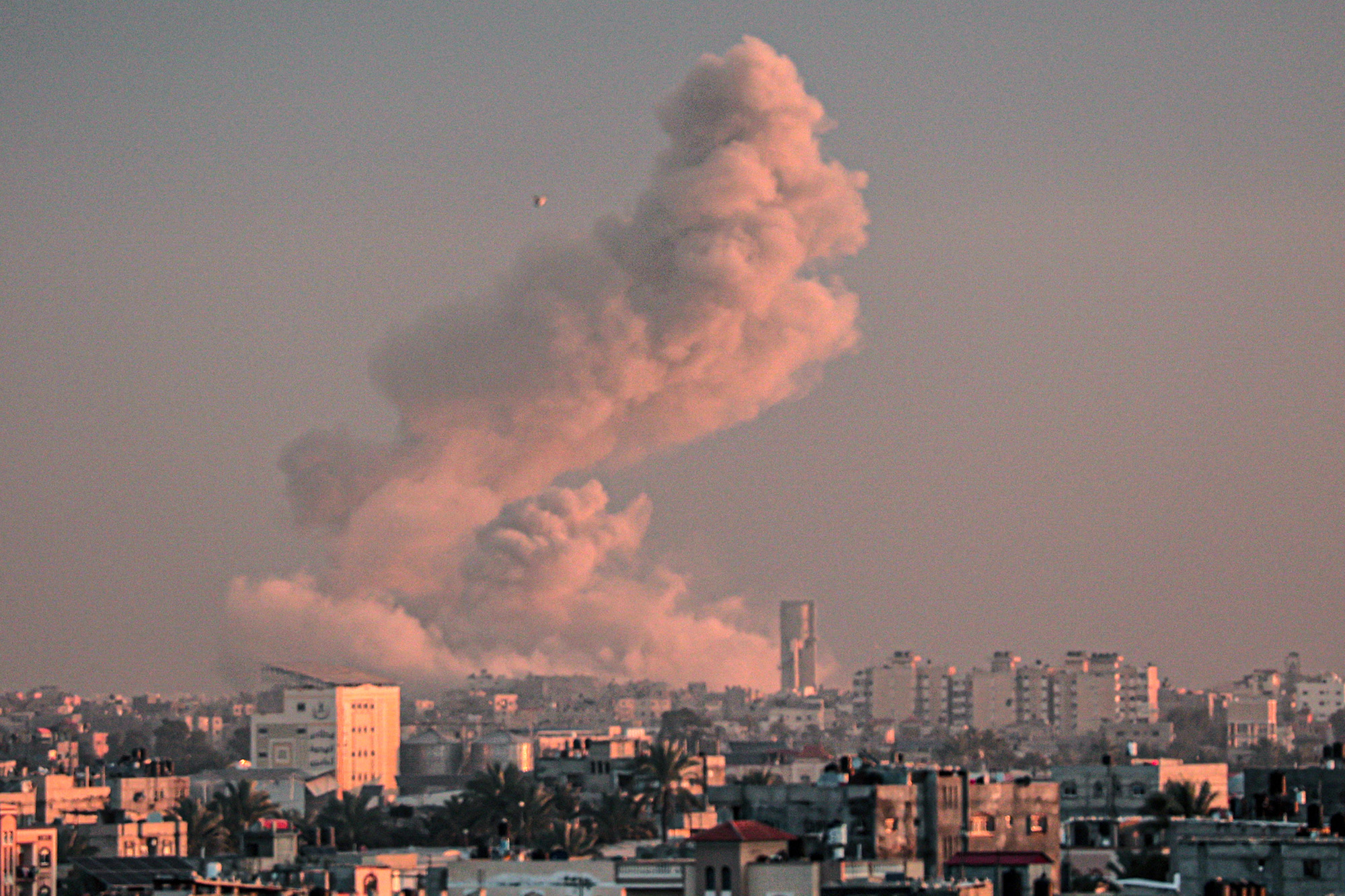 Smoke rises over buildings in Khan Younis following Israeli bombardment on February 5.