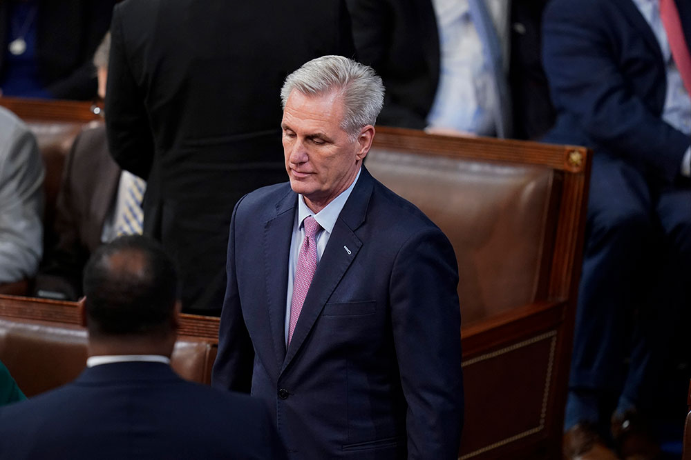 McCarthy walks backmost  to his spot   aft  speaking with Gaet.