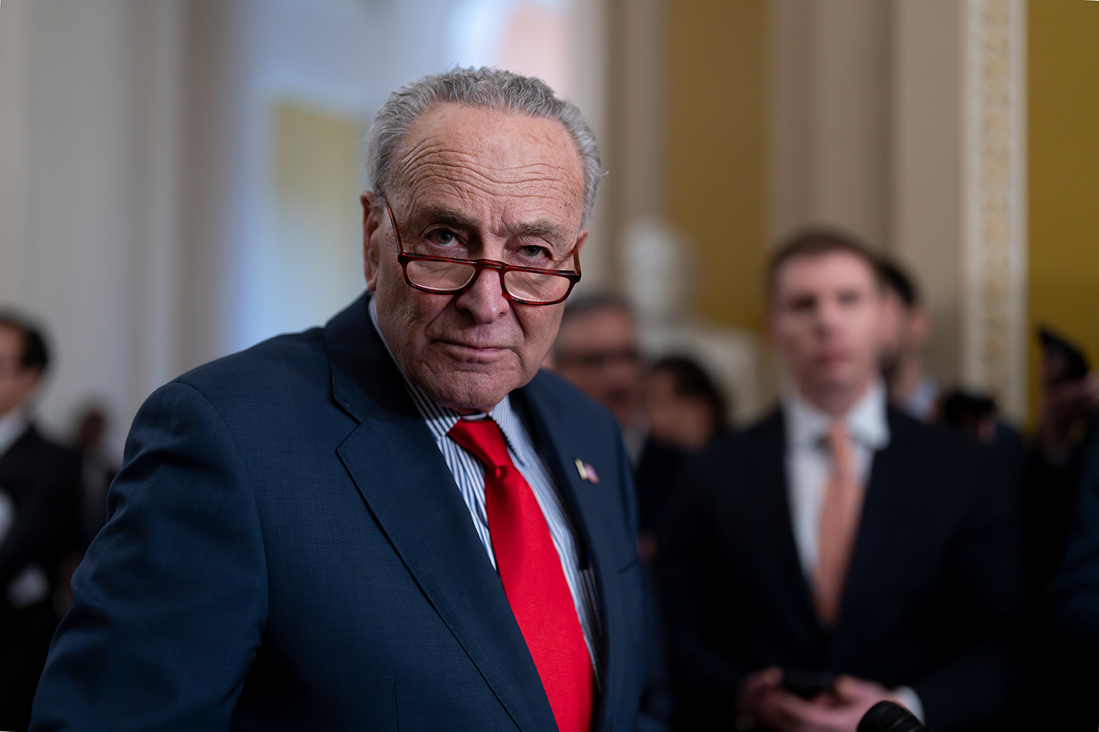 Chuck Schumer speaks to reporters at the Capitol in Washington, on March 12.