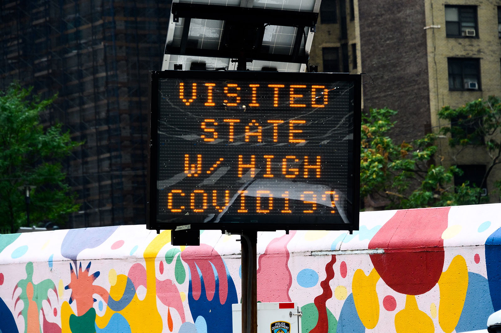 A sign displays a Covid-19 travel advisory in New York City on September 1.