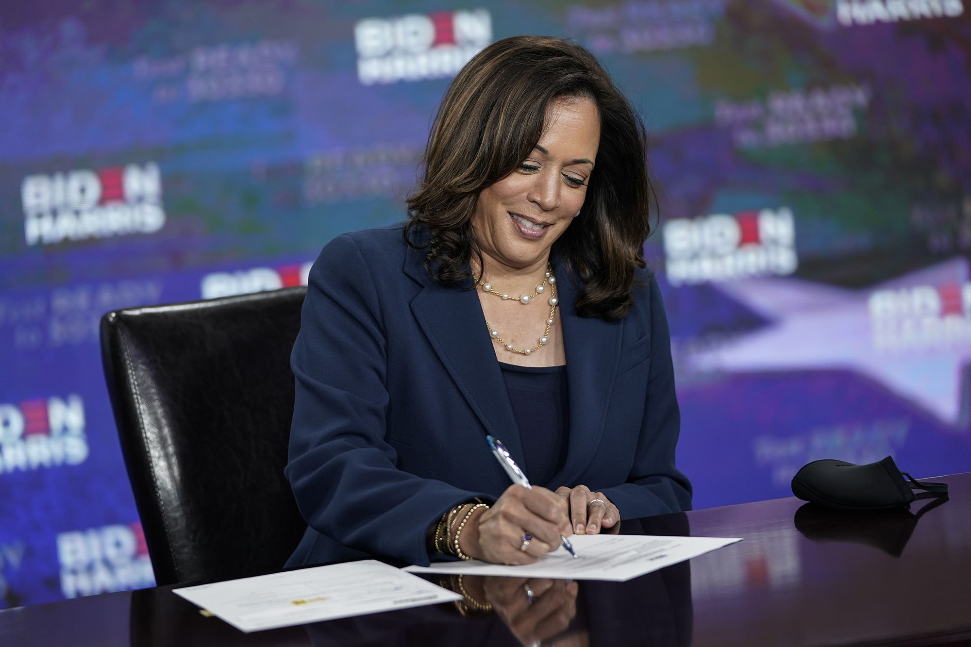 Presumptive Democratic vice presidential nominee, Sen. Kamala Harris signs required documents for receiving the Democratic nomination for Vice President of the United States at the Hotel DuPont on August 14 in Wilmington, Delaware. 