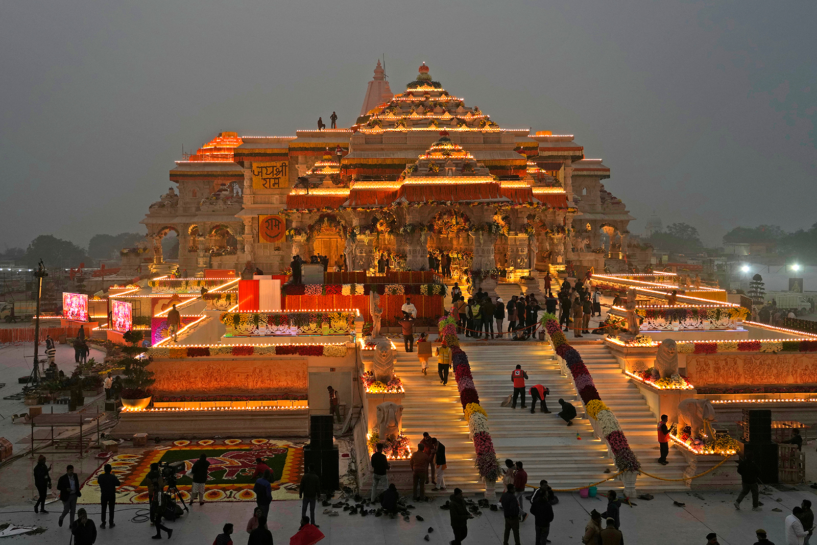 Workers decorate a temple dedicated to Hindu deity Lord Ram the day before it's grand opening in Ayodhya, India, on January 21.