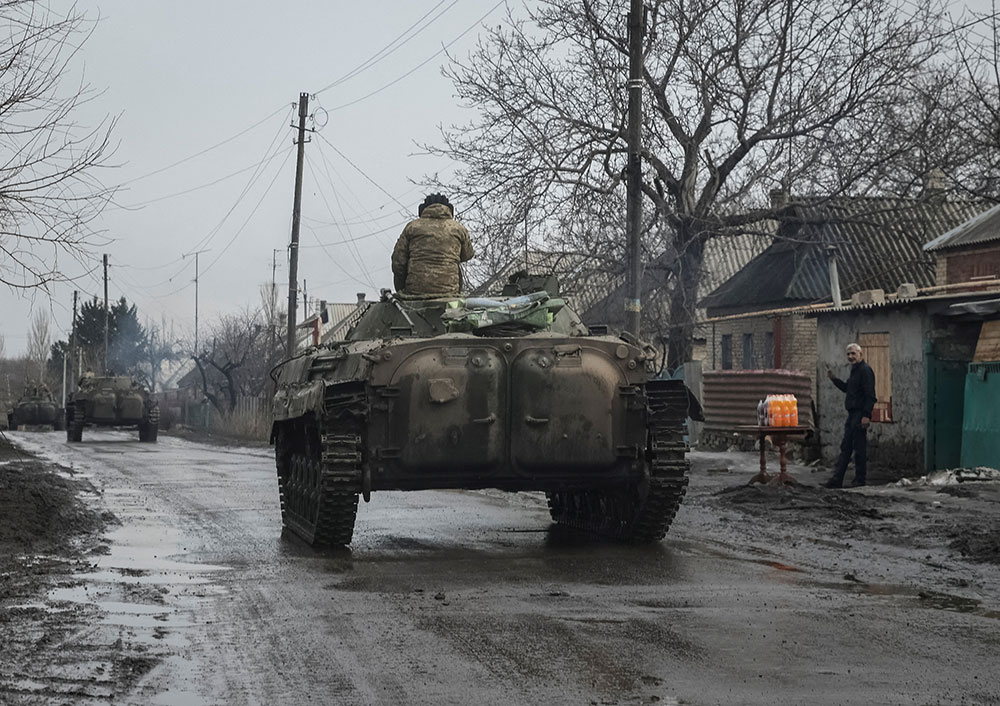 Ukrainian service members ride BMP-2 infantry fighting vehicles near the frontline city of Bakhmut, Ukraine, on  February 27.