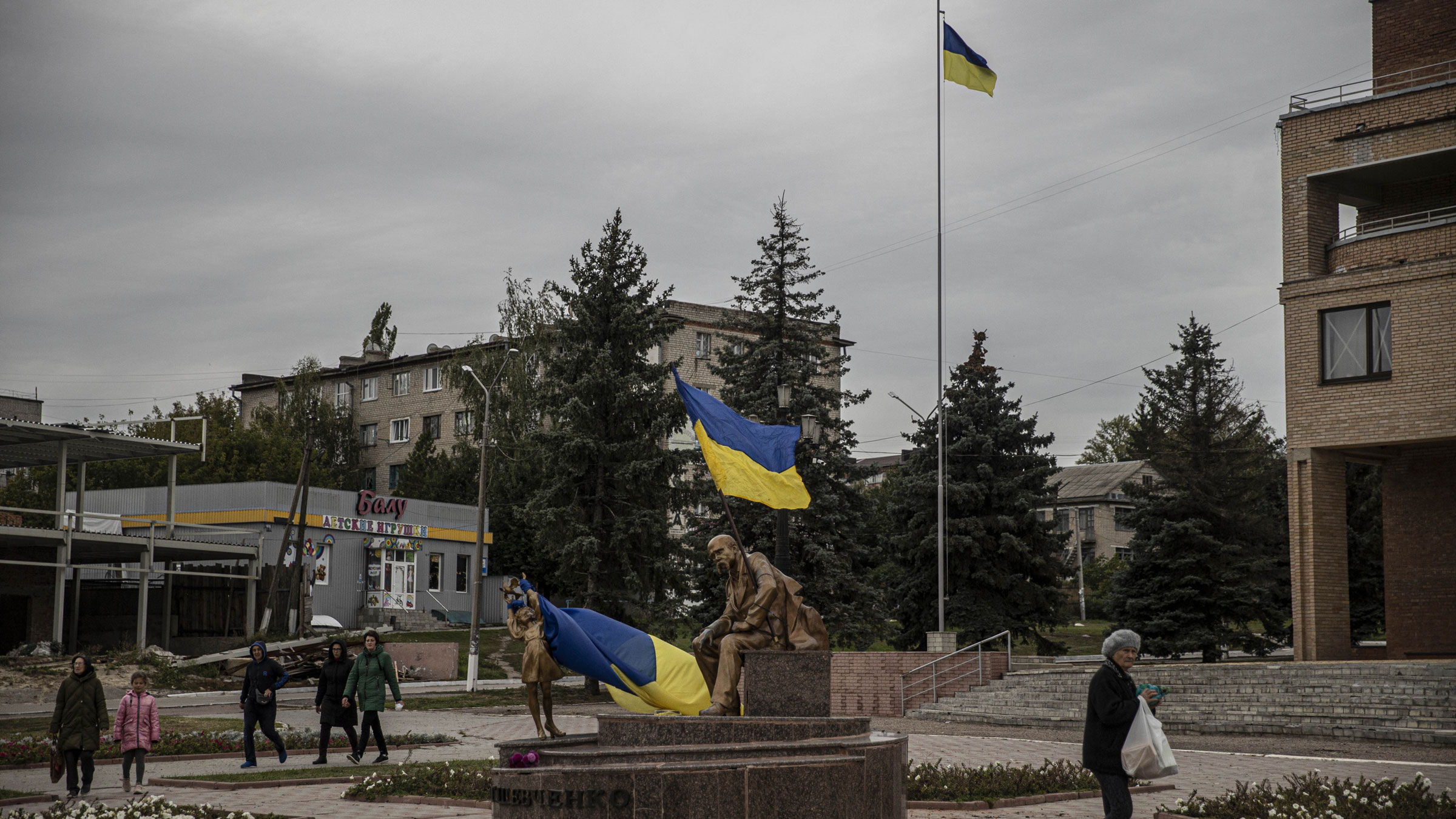 Ukrainian flags wave in the liberated town of Balakliya on Sunday.