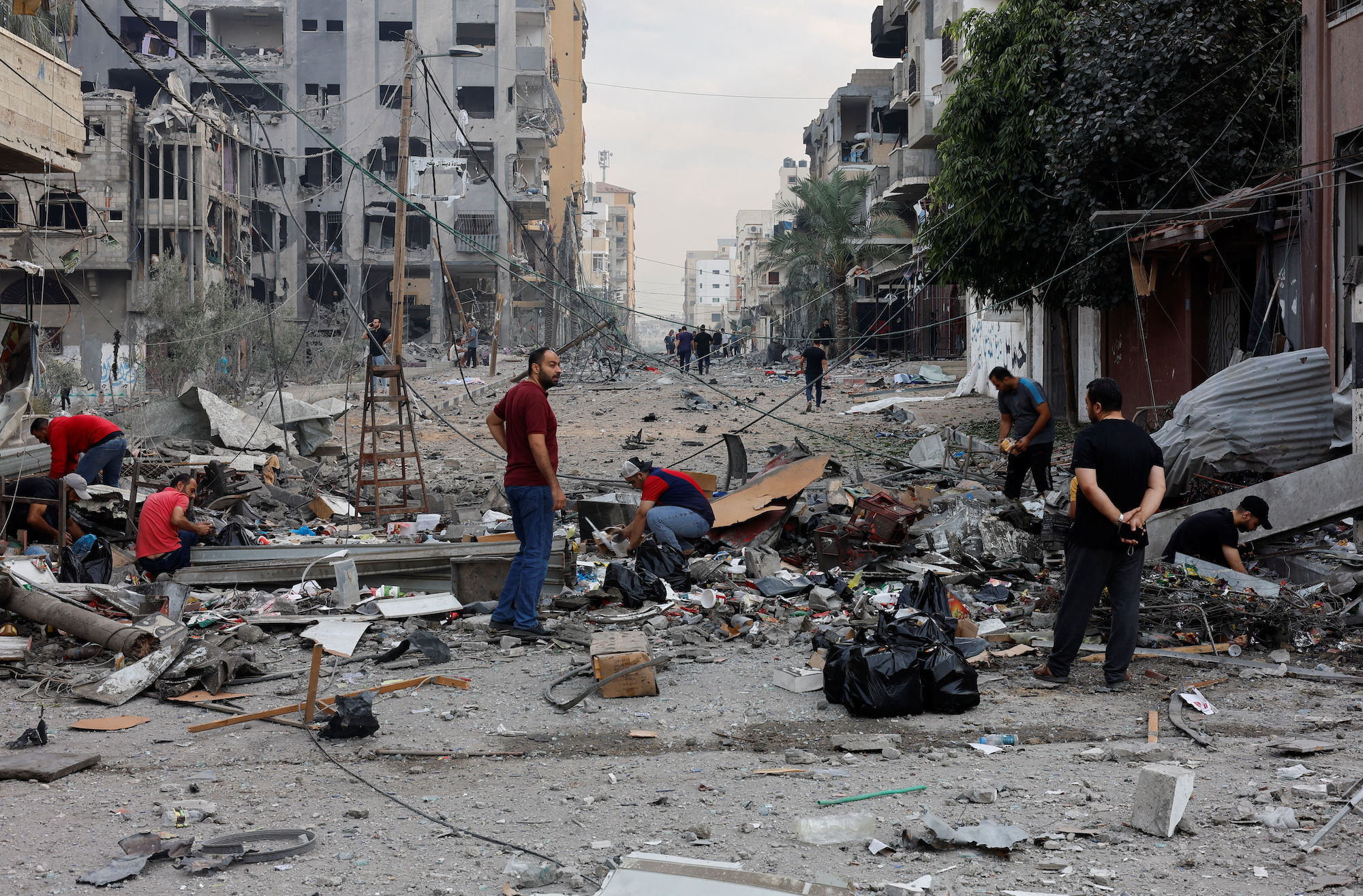 Palestinians inspect damage in the aftermath of Israeli strikes in northern Gaza on Wednesday.