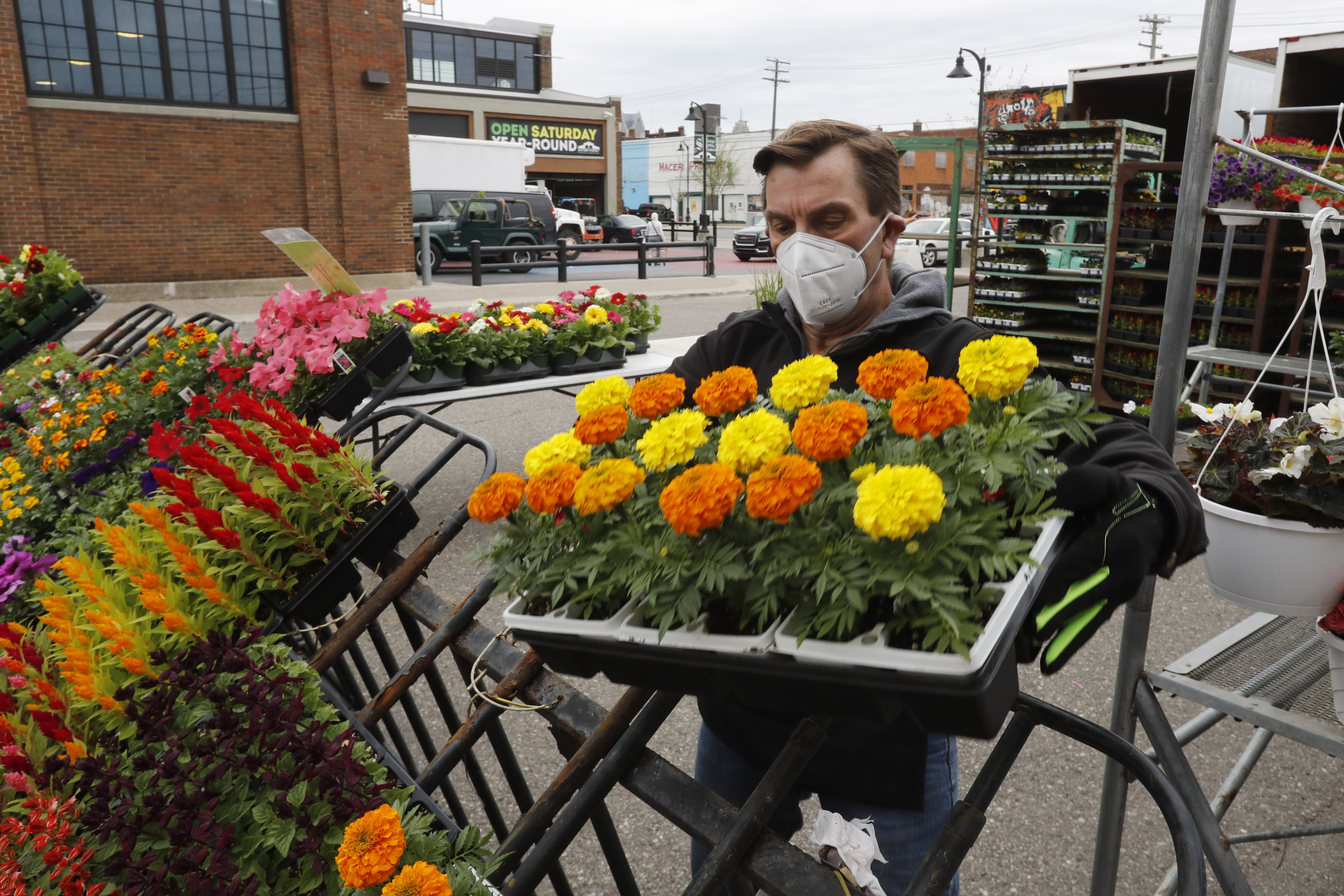 John Spens of Geier Farms sets up at the Detroit Farmers Market on May 2.