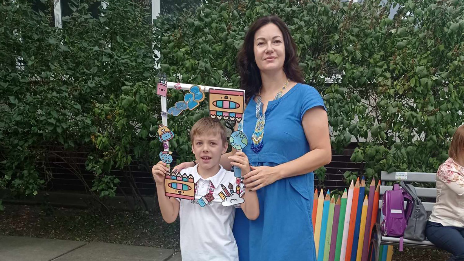 Kateryna Pylypenko pictured with her son on his first day of school on Friday.