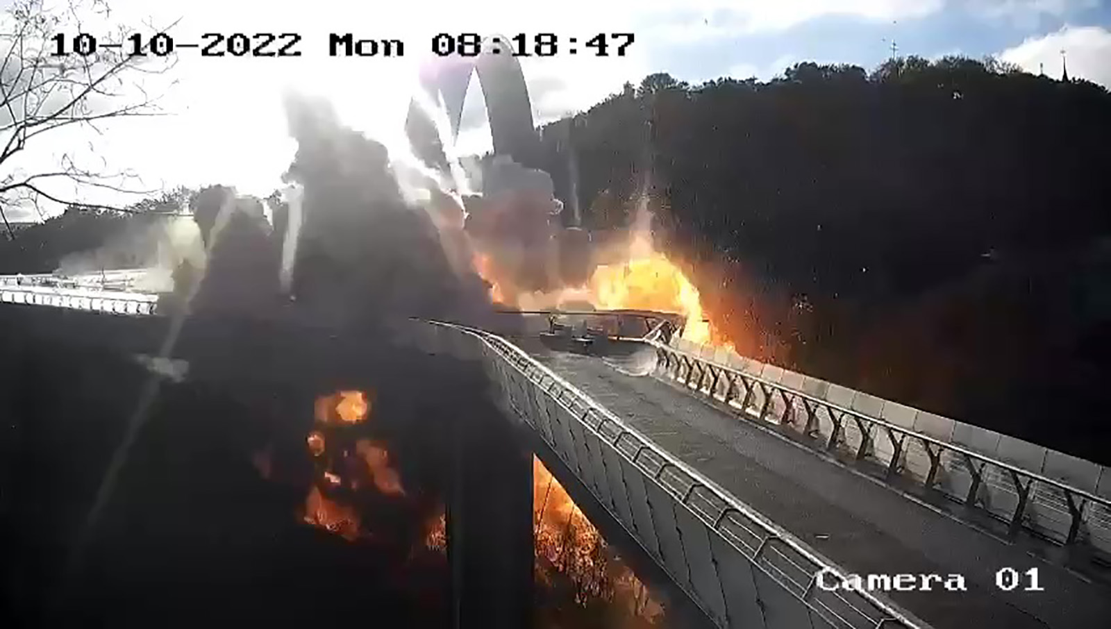 A screen grab taken from a surveillance camera shows an explosion on a bridge in the Shevchenkivskyi district of the Ukrainian capital, Kyiv, on October 10.