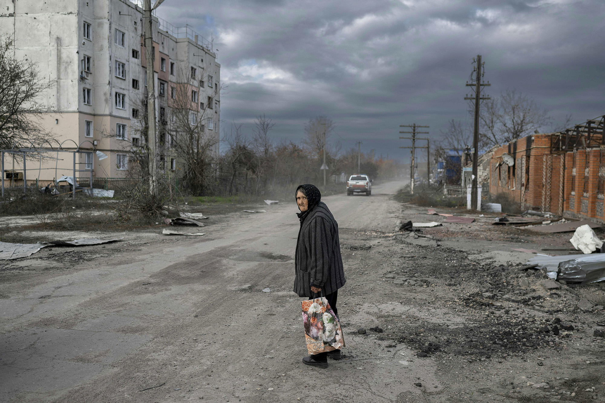 A woman walks in the village of Arkhanhelske in Kherson, Ukraine, on November 3.