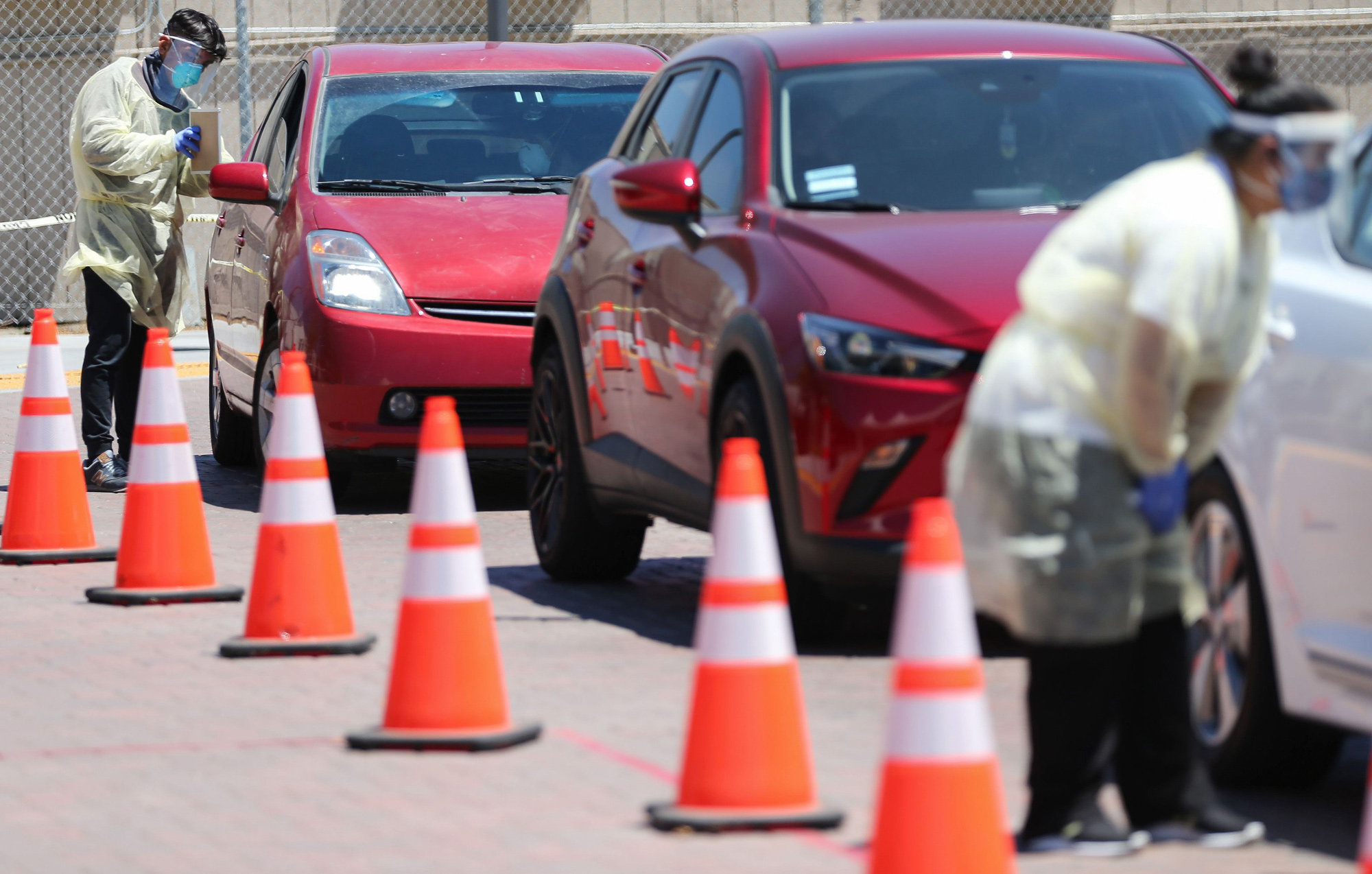 Vehicles line up at a drive-in COVID-19 testing center at Charles R. Drew University of Medicine and Science on July 31 in Los Angeles.