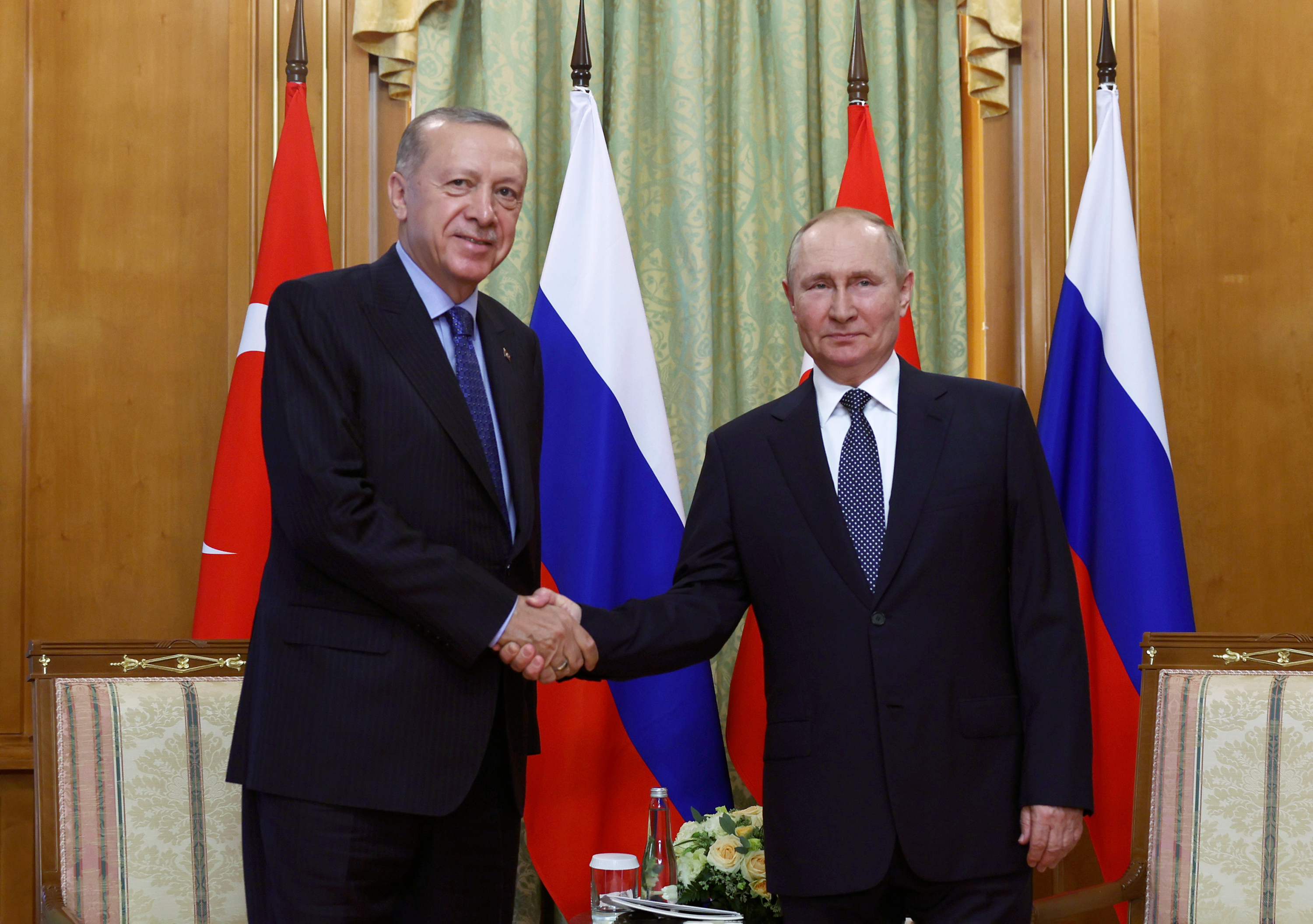 Turkish President Recep Tayyip Erdogan and Russian President Vladimir Putin shake hands prior to their meeting in Sochi, Russia on August 5. 