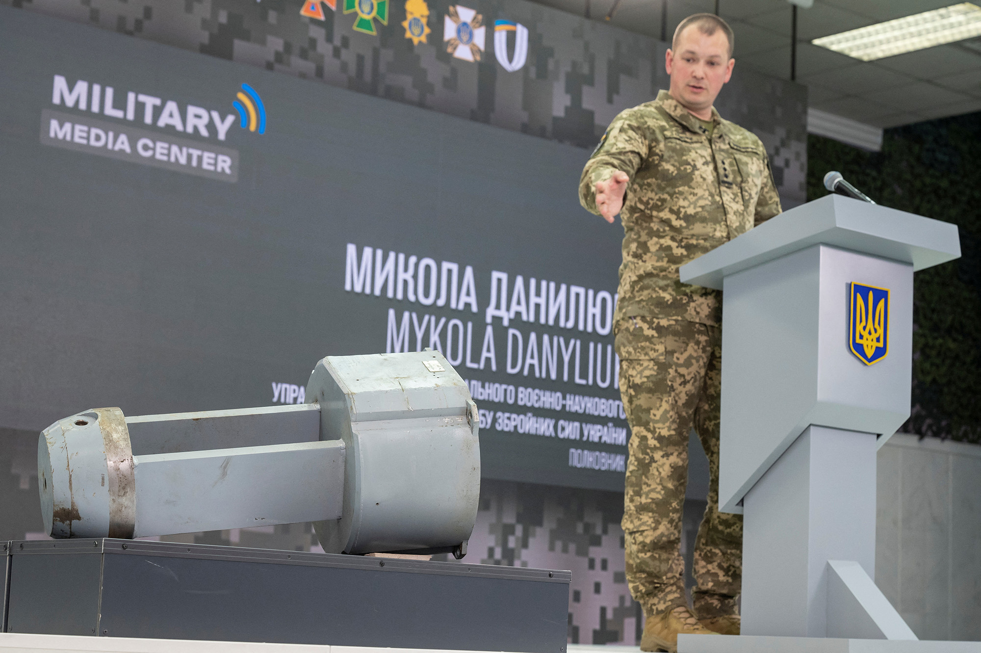 Colonel Mykola Danyliuk points at a dud warhead imitating a nuclear part of a Kh-55SM strategic cruise missile, during a news conference in Kyiv, Ukraine, on December 1.