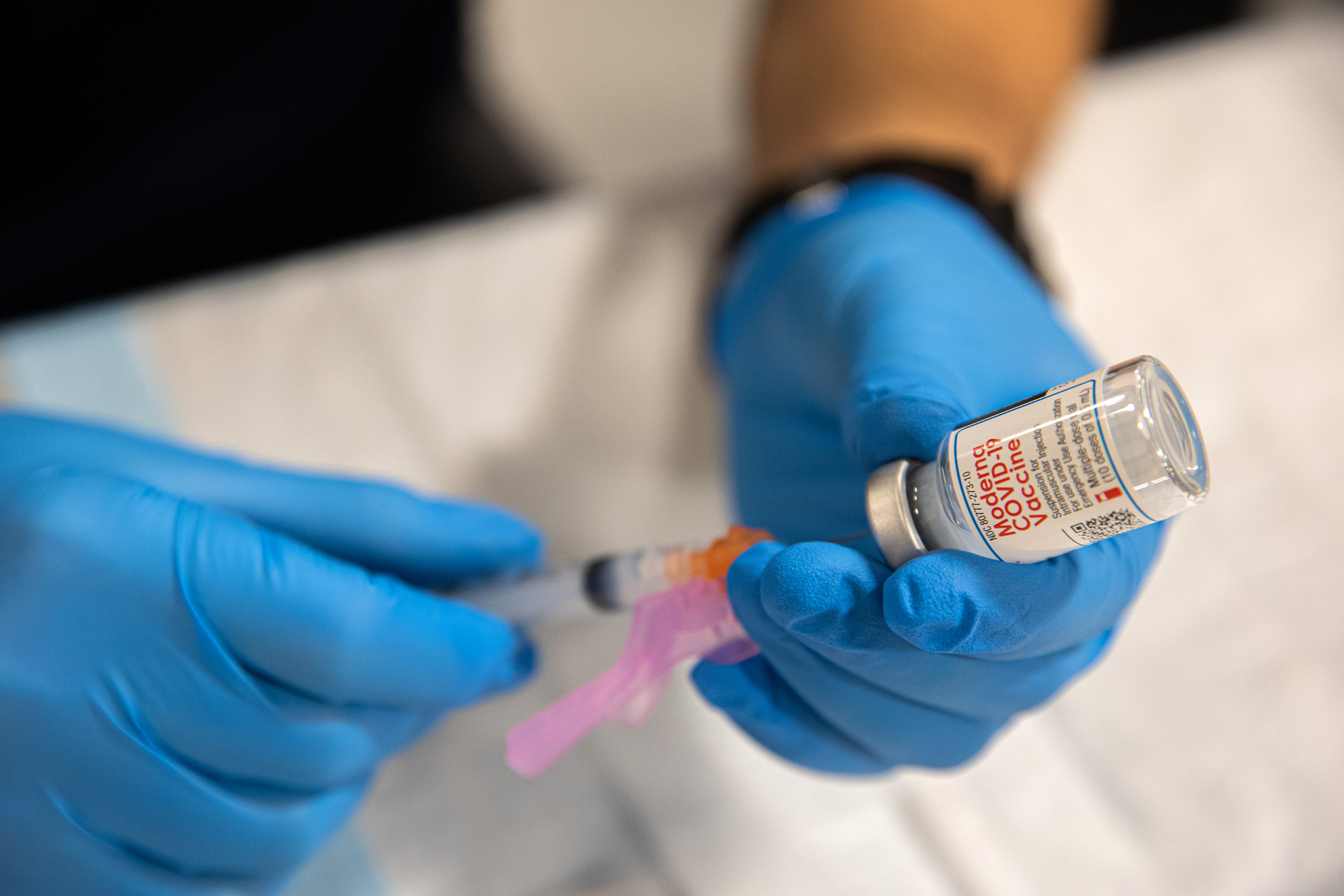 A healthcare worker prepares a dose of the Moderna Covid-19 vaccine at Queens Police Academy on Monday, January 11 in New York.
