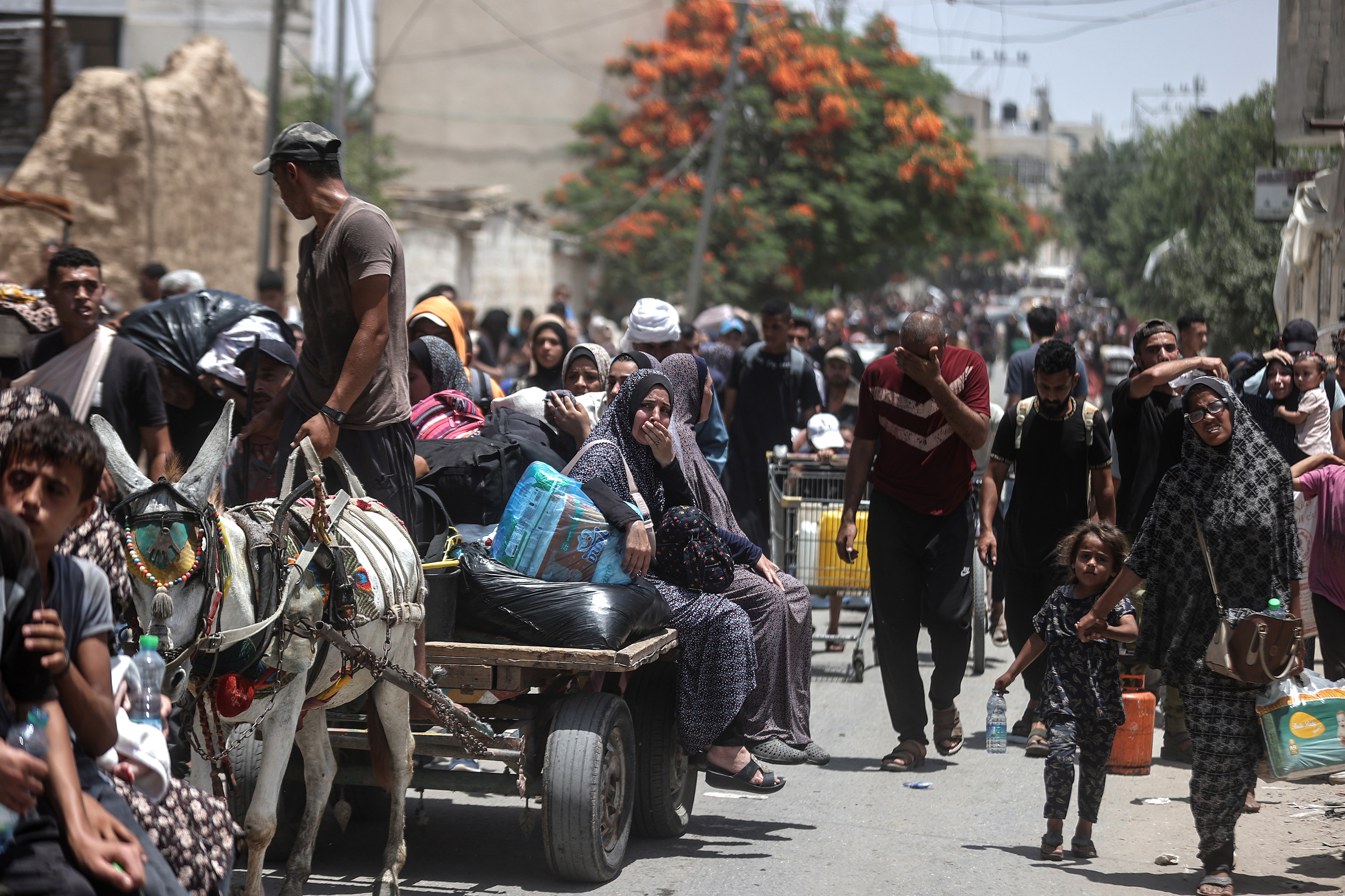Palestinians pack their belongings to migrate to safer areas following attacks in Deir al-Balah, Gaza, on June 8. 
