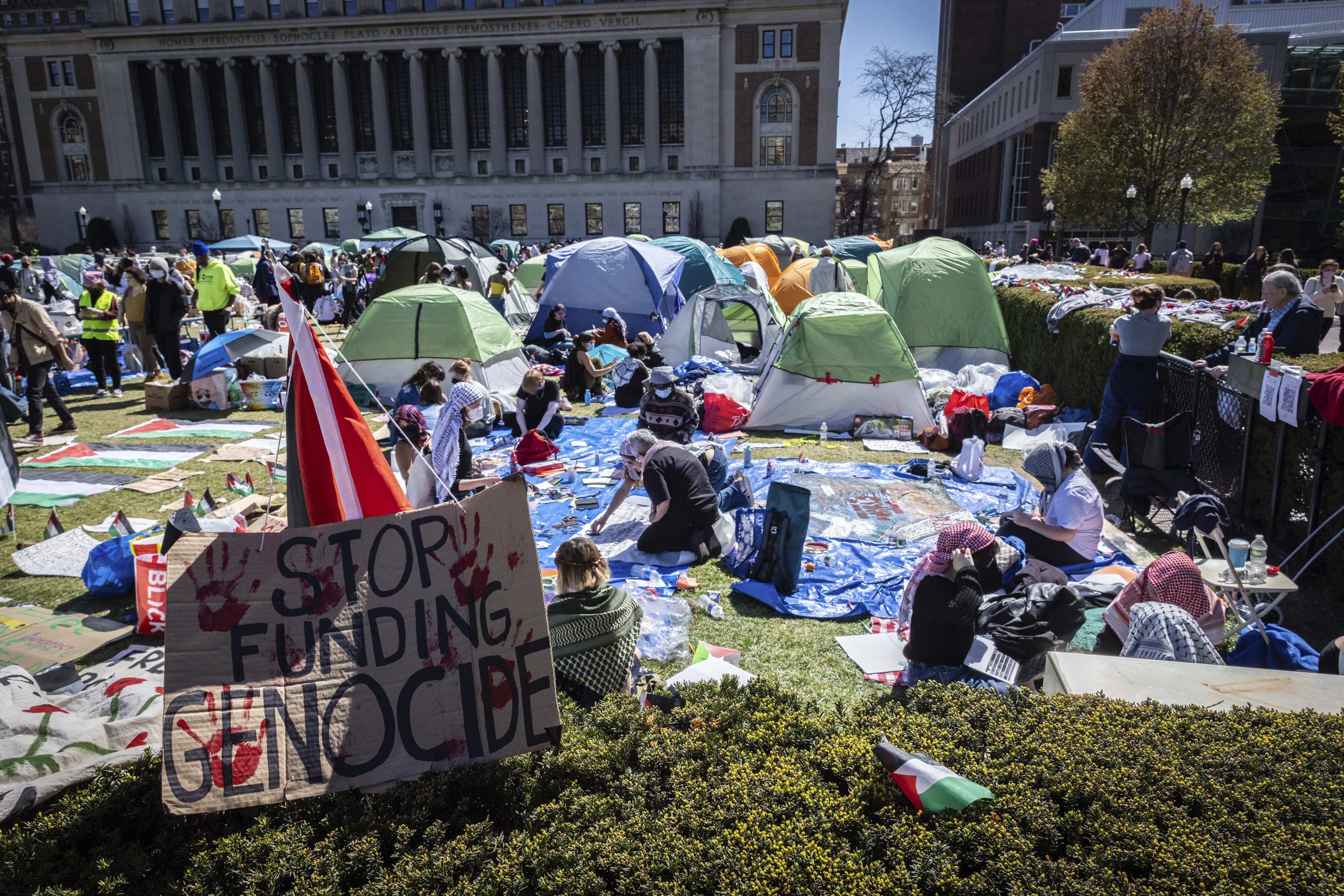 A sign reads “STOP FUNDING GENOCIDE” at a pro-Palestinian encampment at Columbia University in New York on April 22.