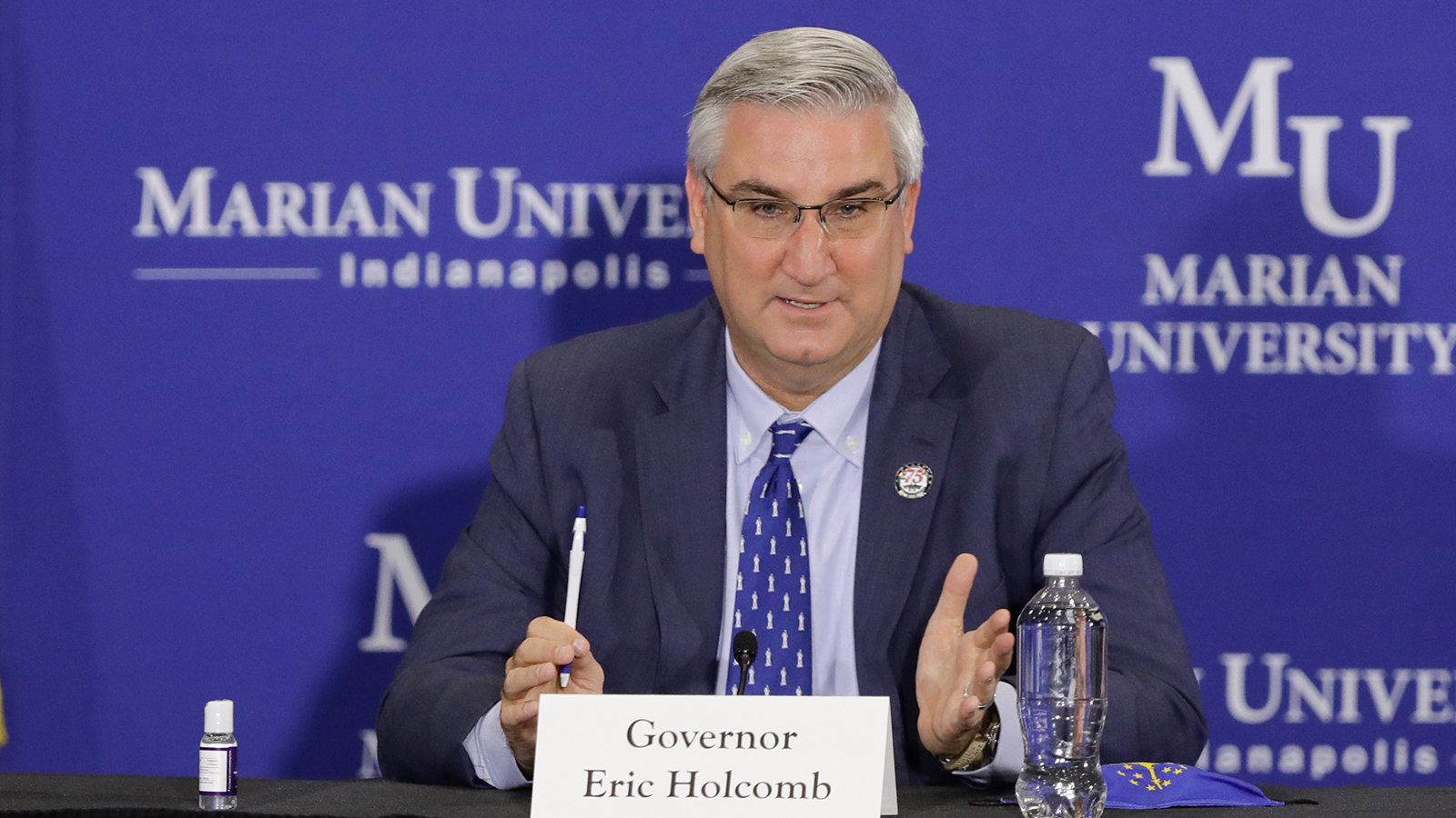 Indiana Gov. Eric Holcomb speaks during a meeting with higher education leaders on safely reopening schools, Friday, July 24 in Indianapolis. 