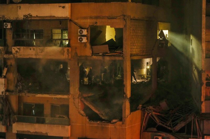 People search for survivors inside an apartment following a massive explosion in Beirut, Lebanon, on January 2.