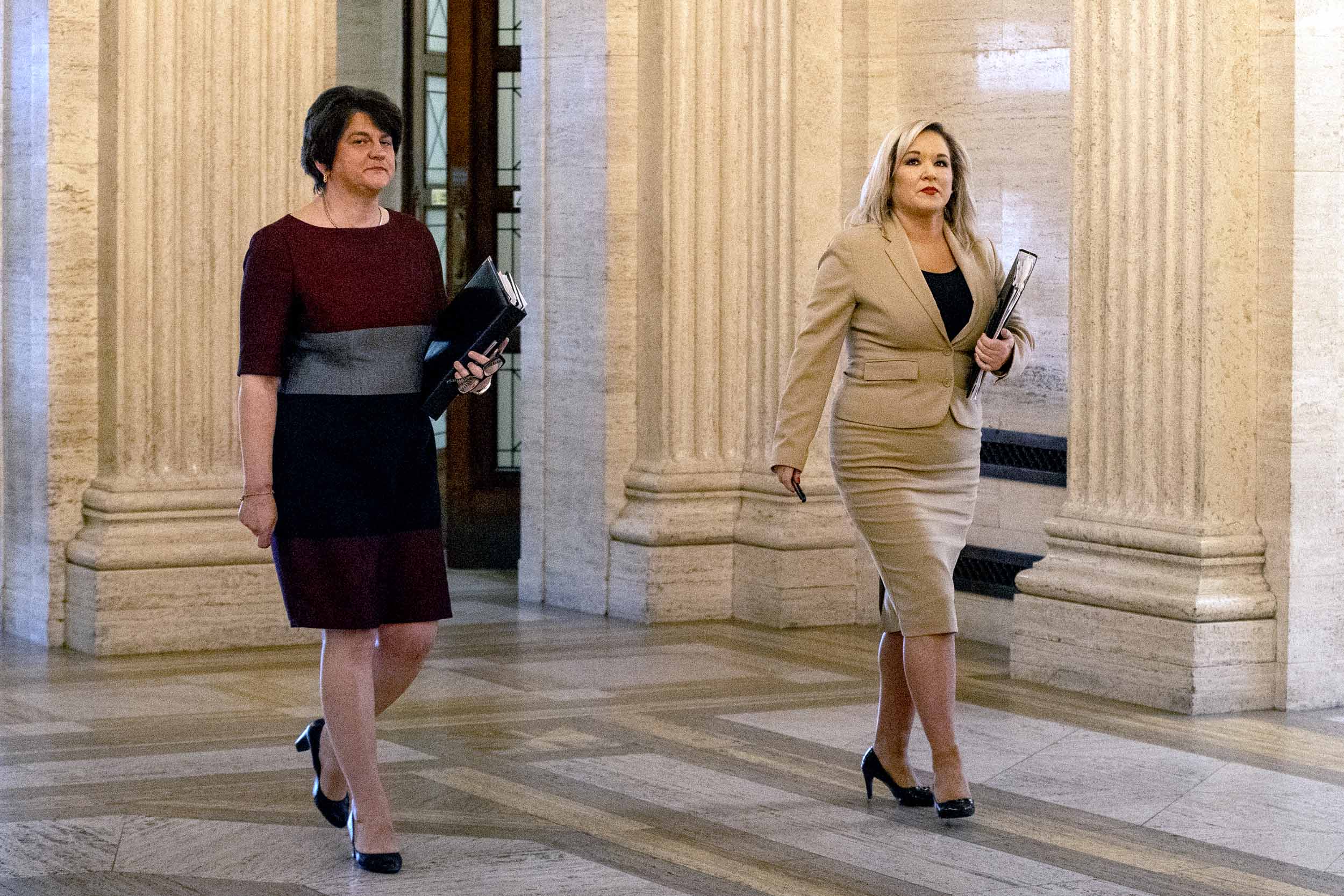 Northern Ireland's First Minister Arlene Foster, left, and Deputy First Minister Michelle O'Neill arrive at Stormont Parliament Buildings in Belfast on May 12.