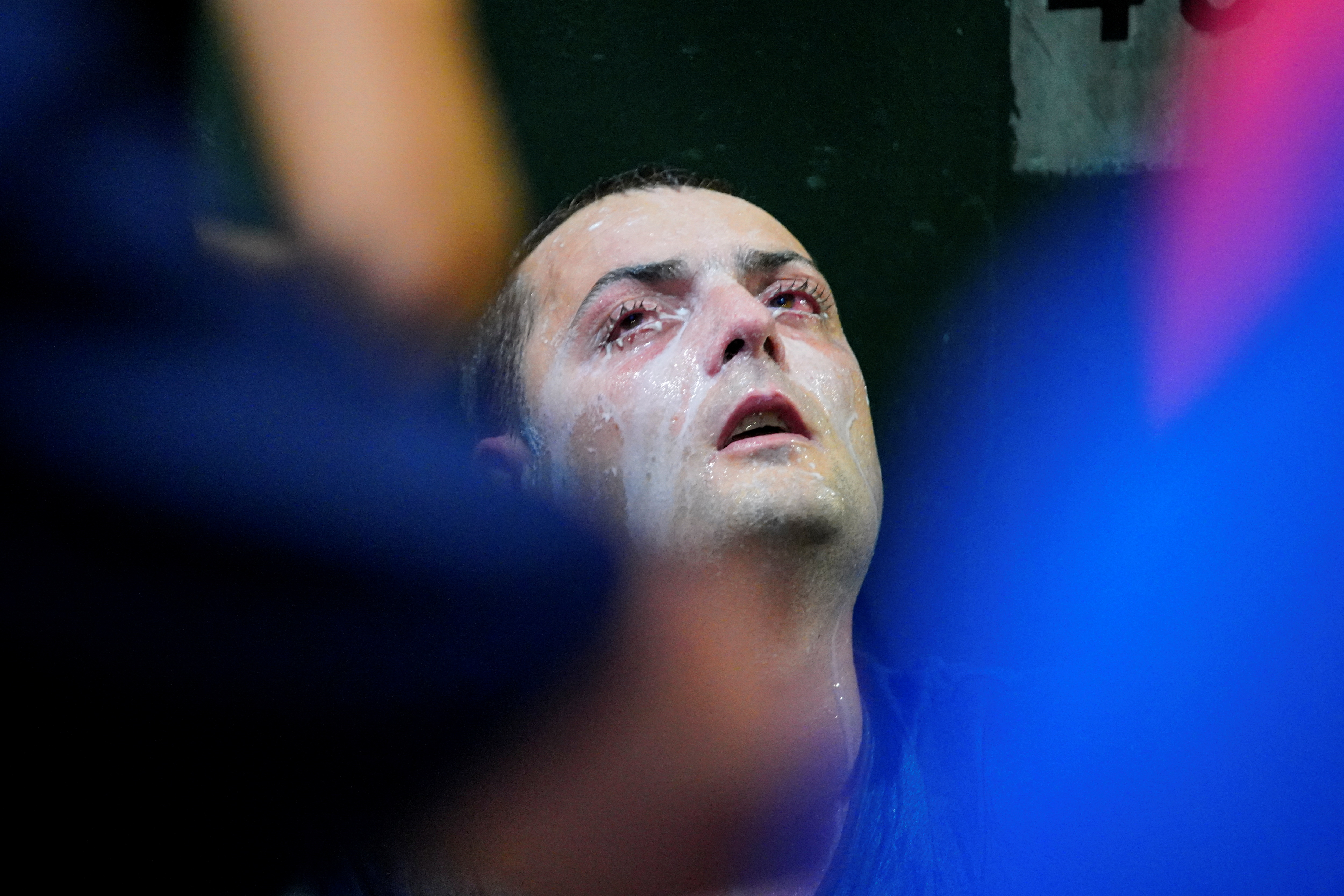 A man after being pepper sprayed during a rally supporting Serbian tennis player Novak Djokovic, in Melbourne, Australia, on January 10. 