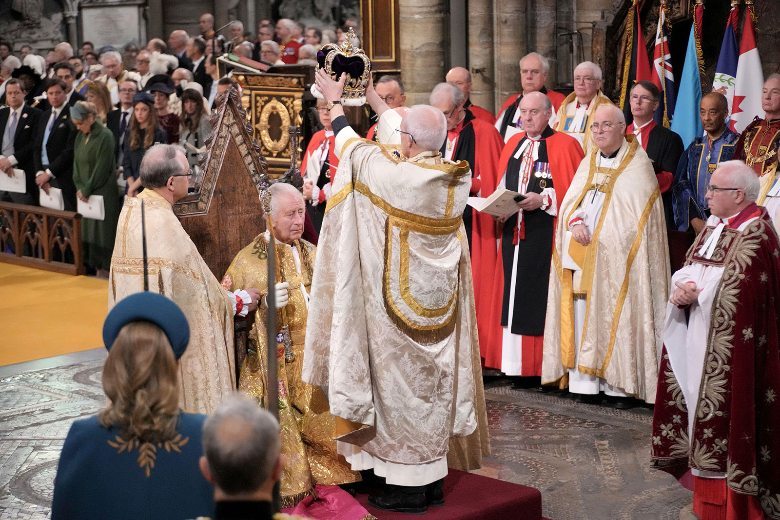 The Archbishop of Canterbury Justin Welby places St. Edward's Crown upon Charles III's head on Saturday.