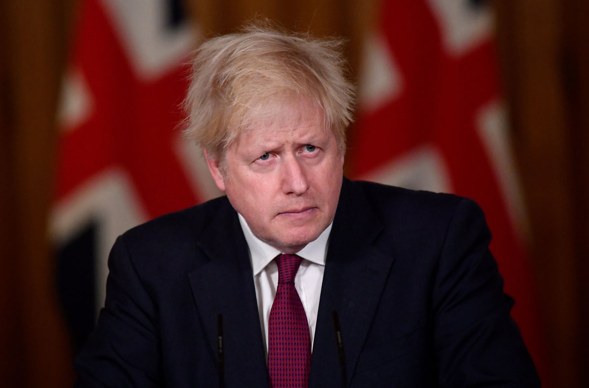 Britain's Prime Minister Boris Johnson speaks during a news conference inside 10 Downing Street on December 19 in London, England.