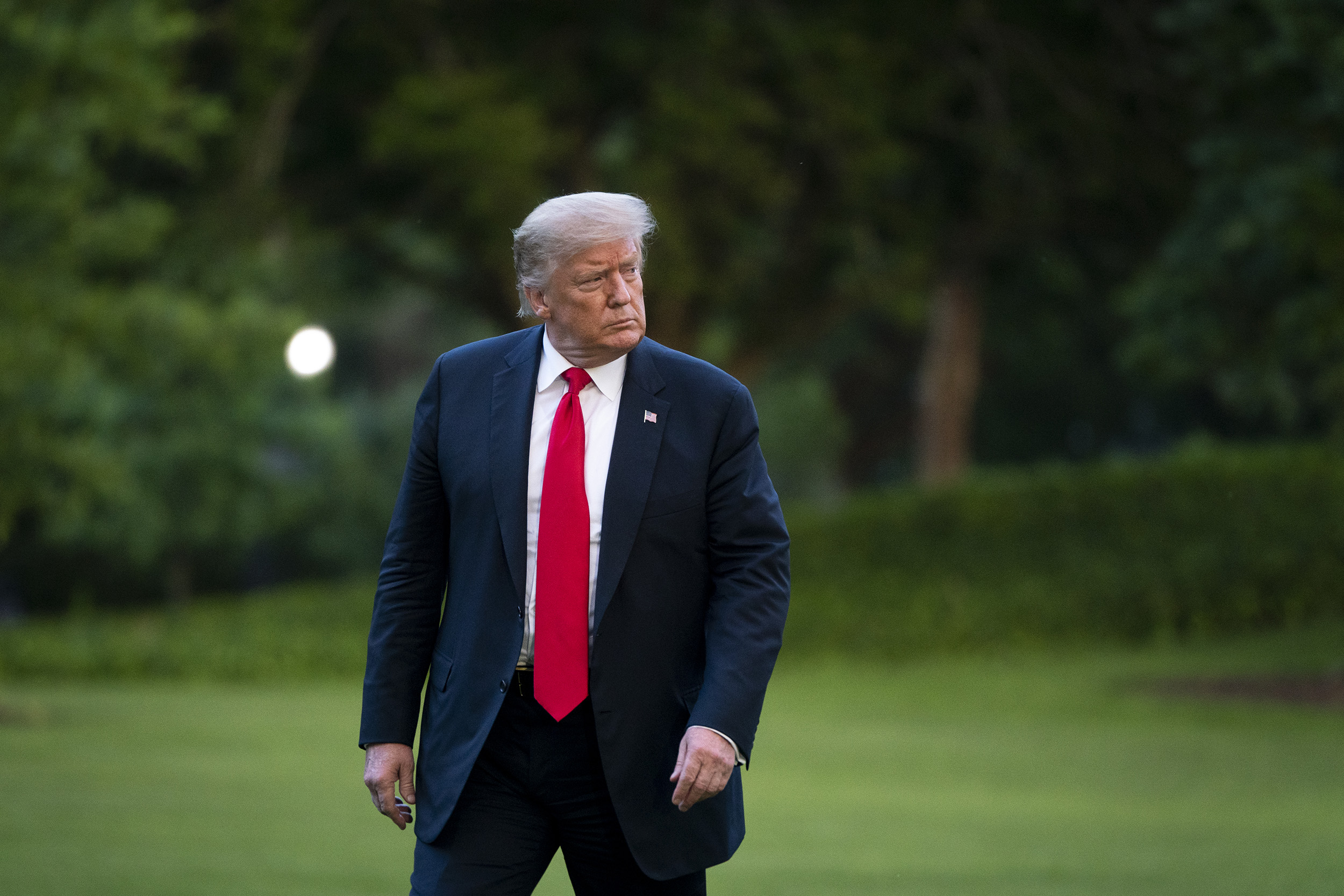 US President Donald Trump walks to the White House residence after exiting Marine One on the South Lawn on June 25, in Washington, DC. 