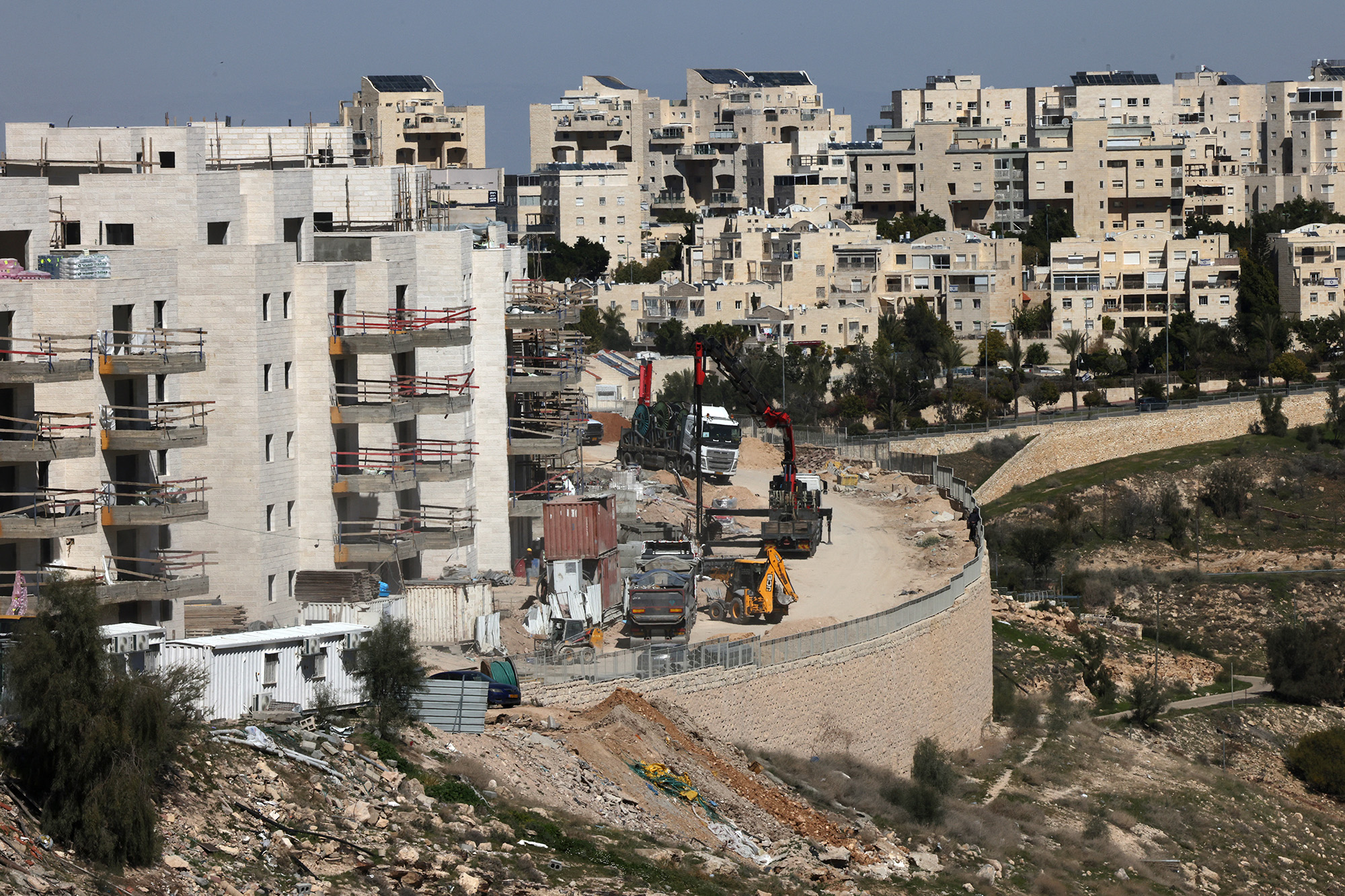 Laborers work at a construction site in the Israeli settlement of Maale Adumim, in the occupied West Bank, on February 29.