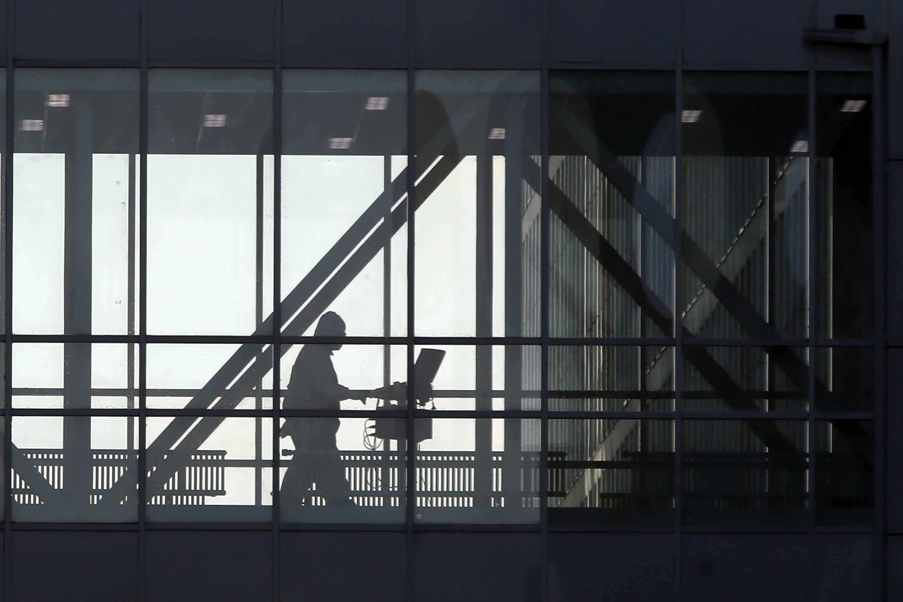 A member of medical staff is seen passing through a skywalk at the Novomoskovsky medical center for patients with suspected COVID-19 infection, in Moscow on November 6.