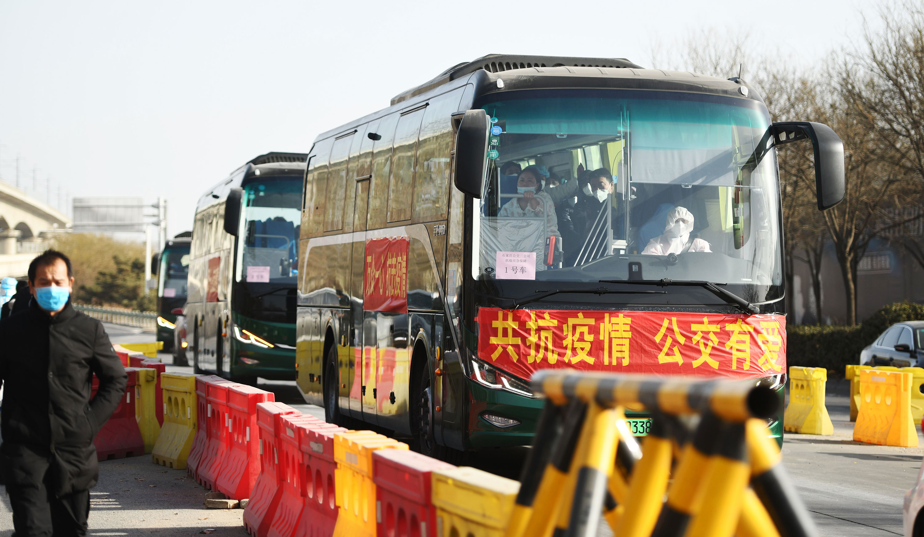 Buses carrying villagers from the Gaocheng district of Shijiazhuang, China, head to centralized quarantine sites on January 11.